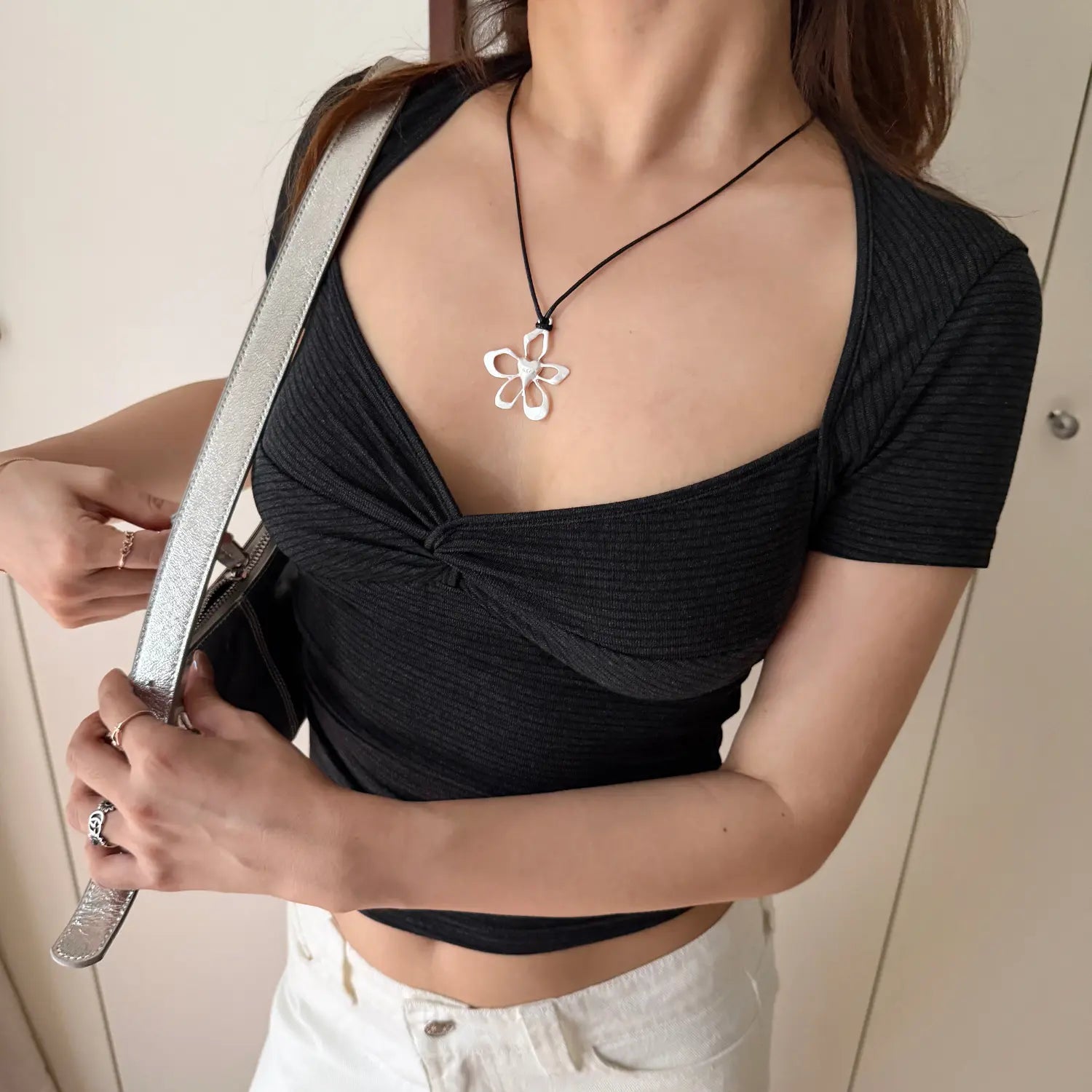 Front lifestyle shot on model of dark heather ribbed knit cropped top, square neck, front twist detail, slim casual short sleeve tee
