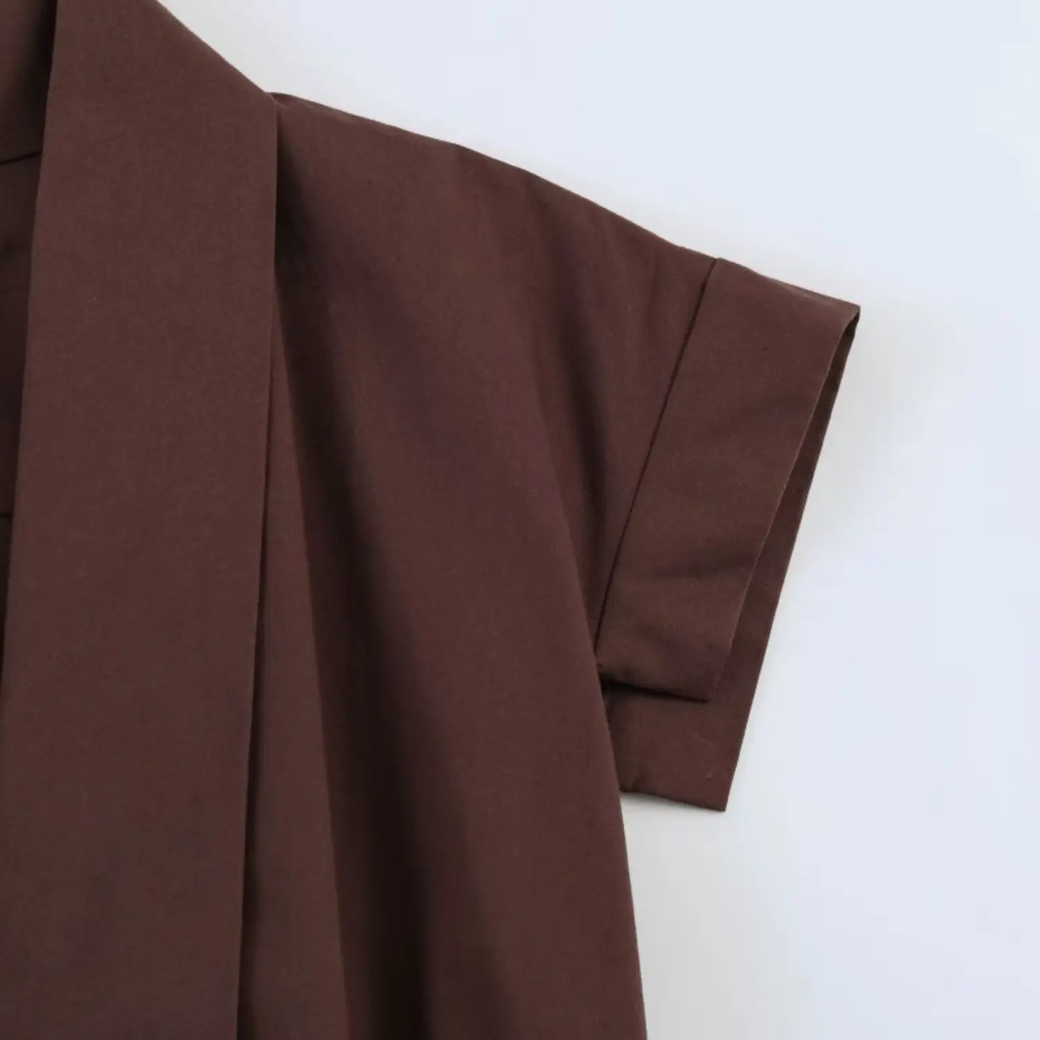 Close‑up of short cap sleeve and shoulder seam
