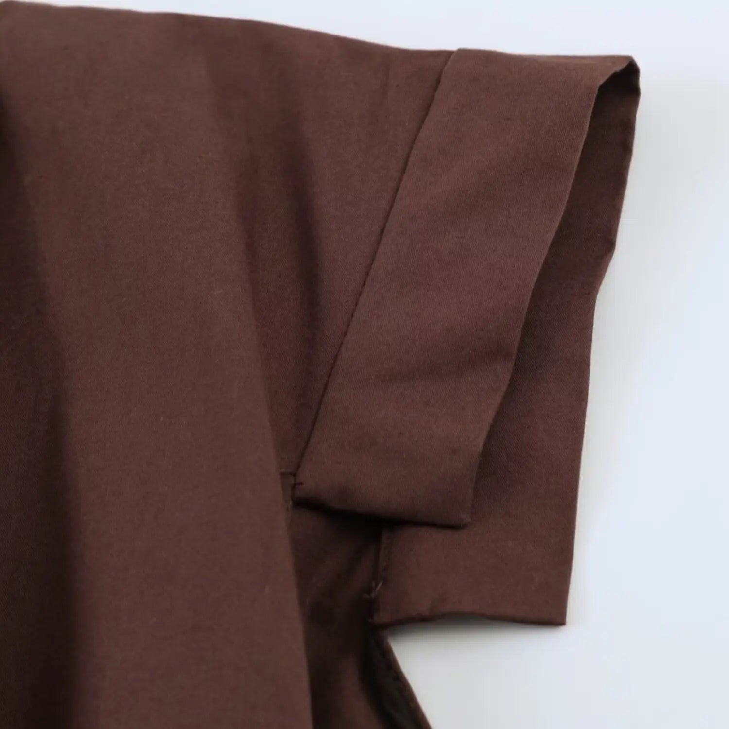 Close‑up of short sleeve folded hem detail