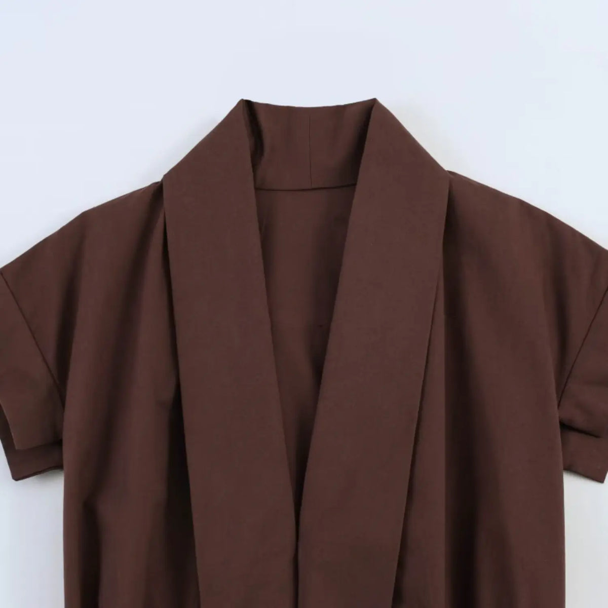 Close‑up of wrap v‑neck lapel collar detail