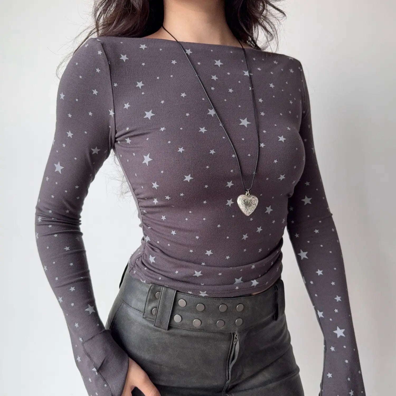 Closeup deep grey star boat neck long sleeve top, side ruching detail flared sleeve stretch bodycon cropped women tee