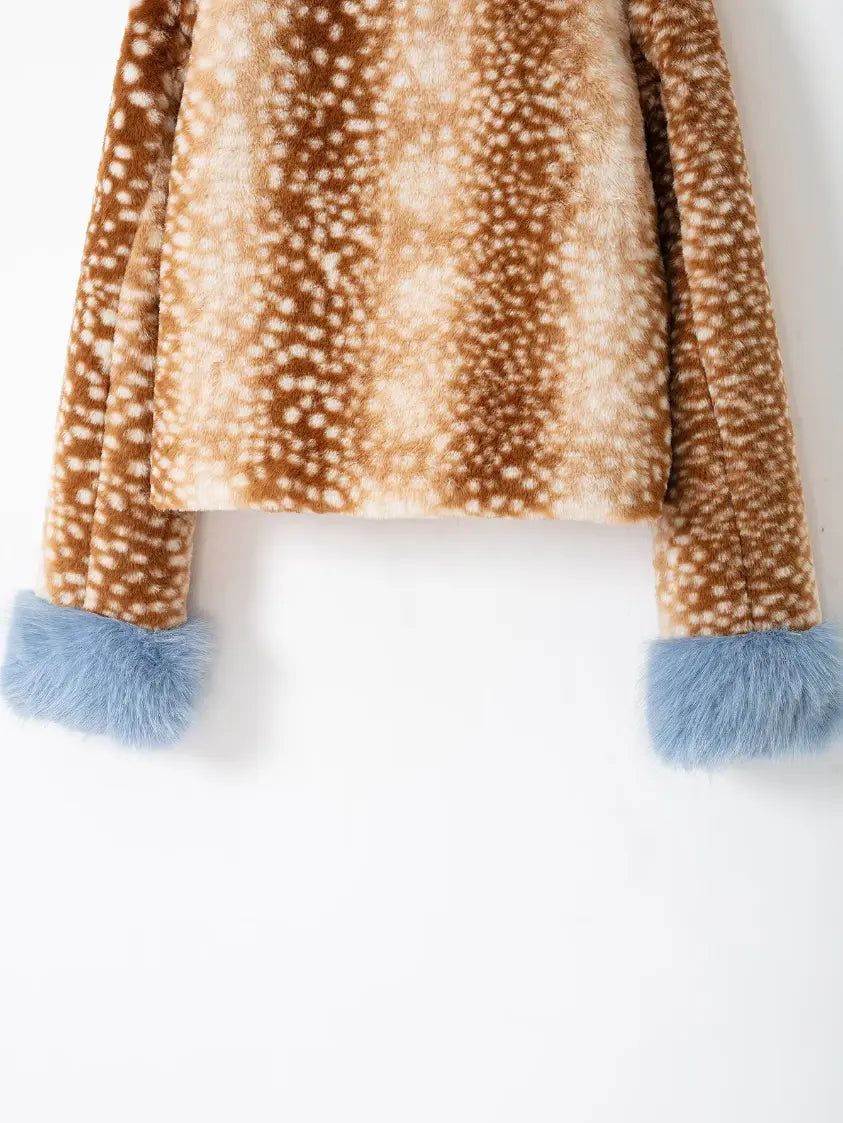 Close-up of back cropped hem and blue fur cuffs