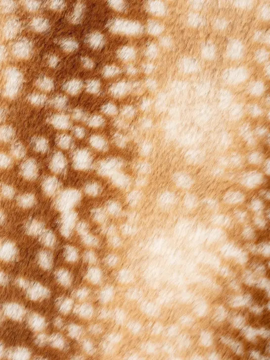 Macro close-up of deer spot print fur fabric texture