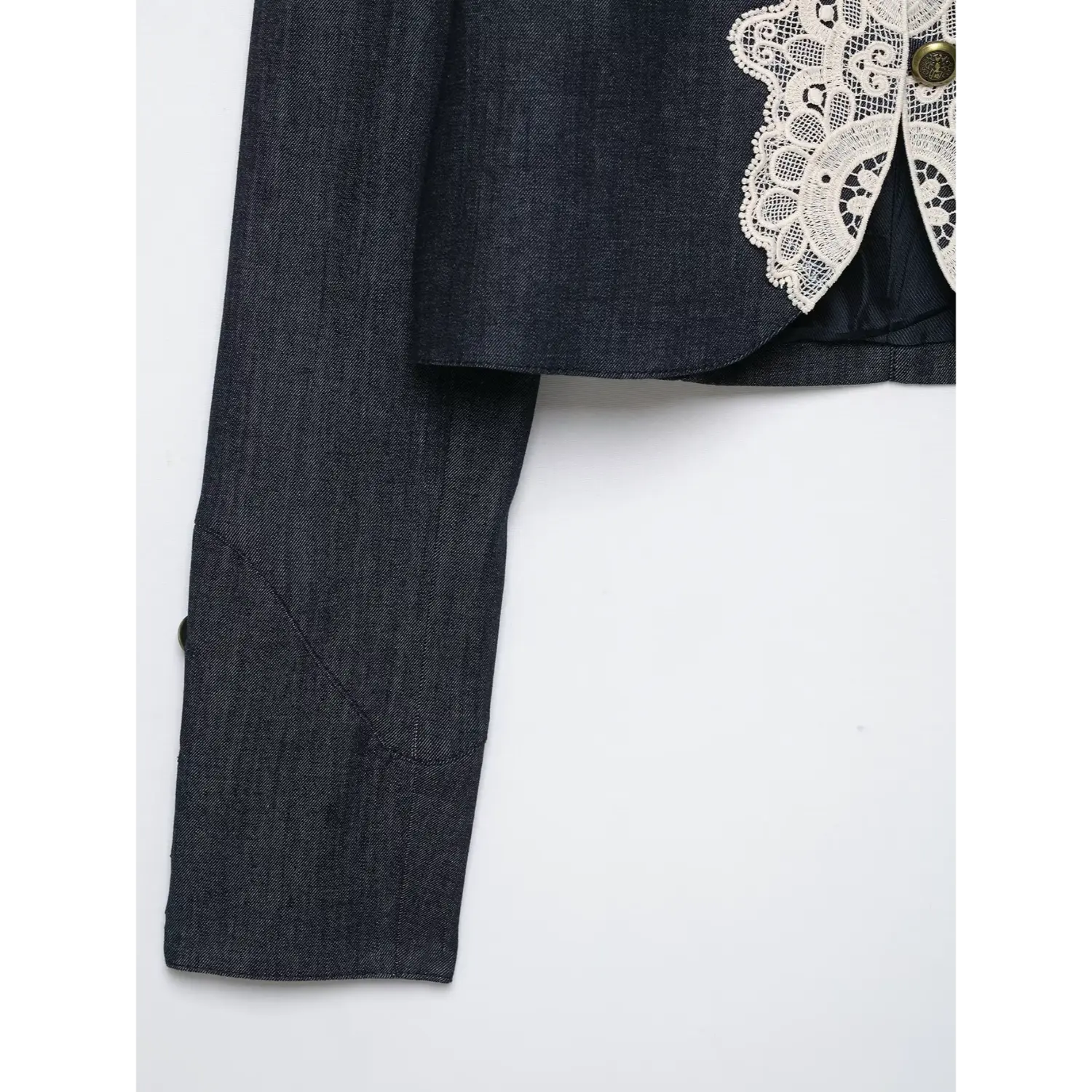 Side view sleeve hem and cropped length dark denim lace jacket