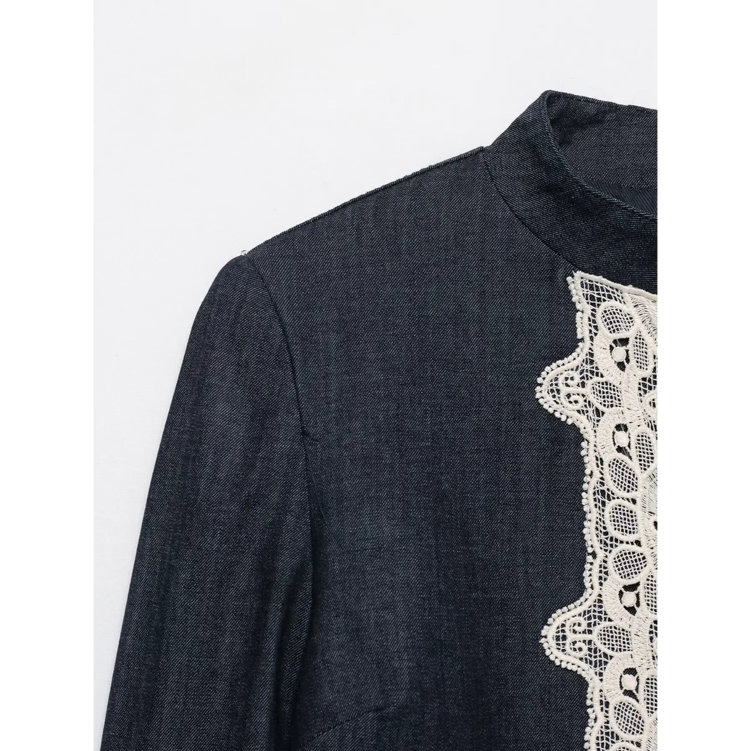 Close-up shoulder and stand collar texture dark denim lace cropped jacket
