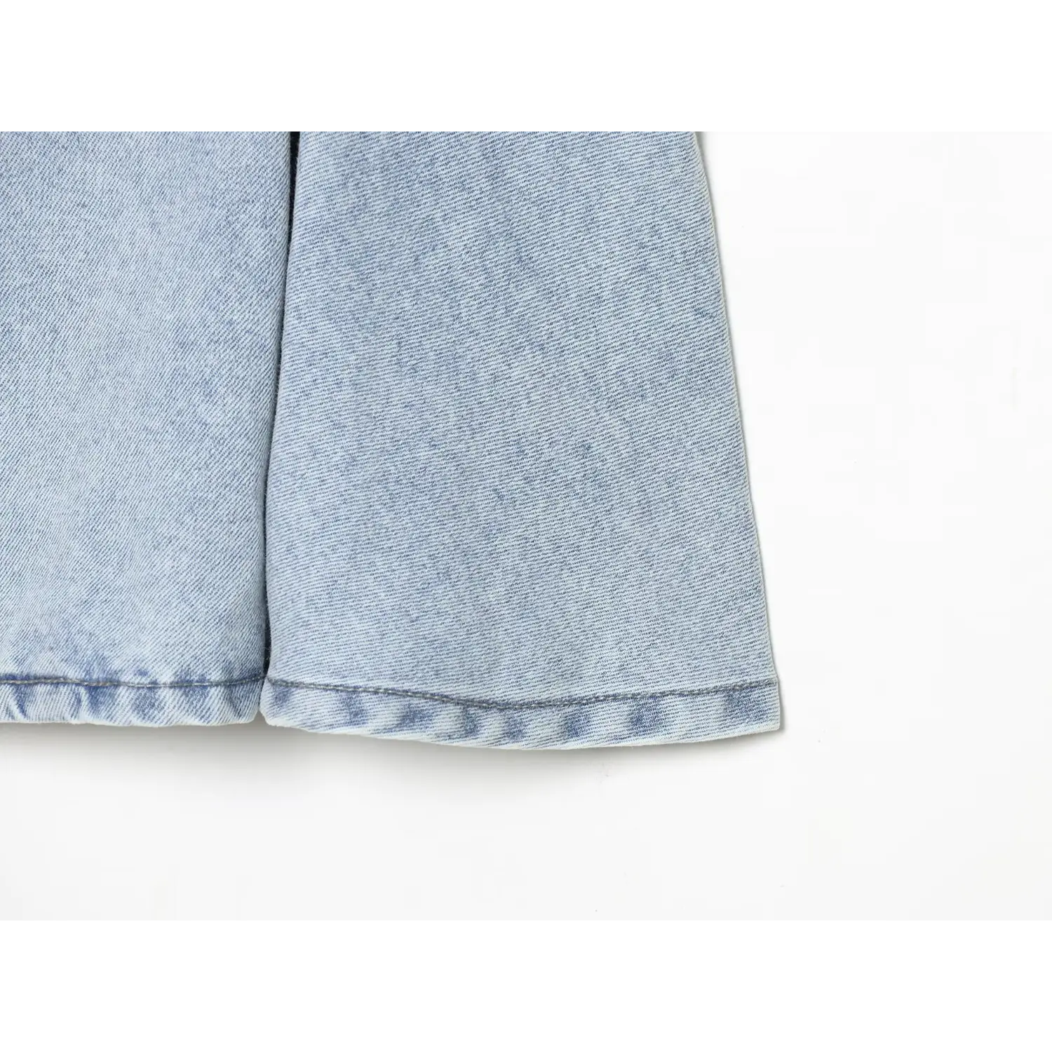 Extreme closeup neat hem topstitch on flared denim skirt part