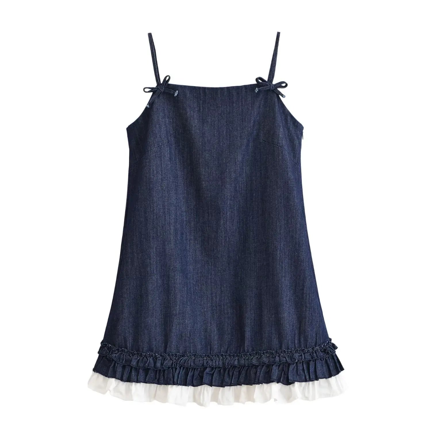 Flat lay front view of dark denim spaghetti strap mini dress with shoulder bow ties and double ruffle hem with white under‑layer, white background