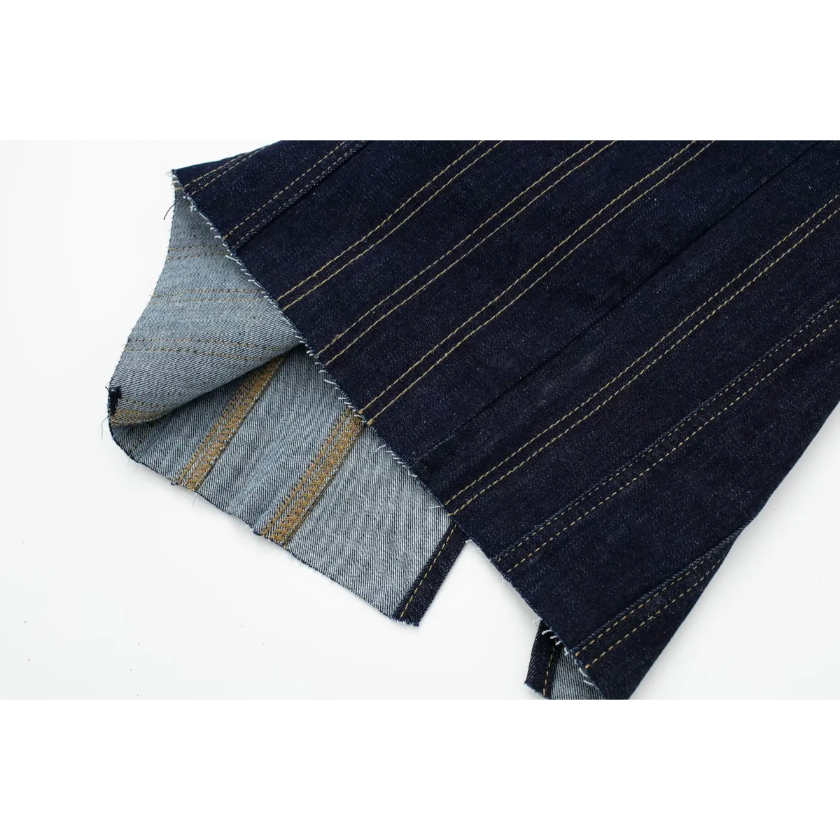 Folded detail view showing denim fabric reverse side and contrast stitching