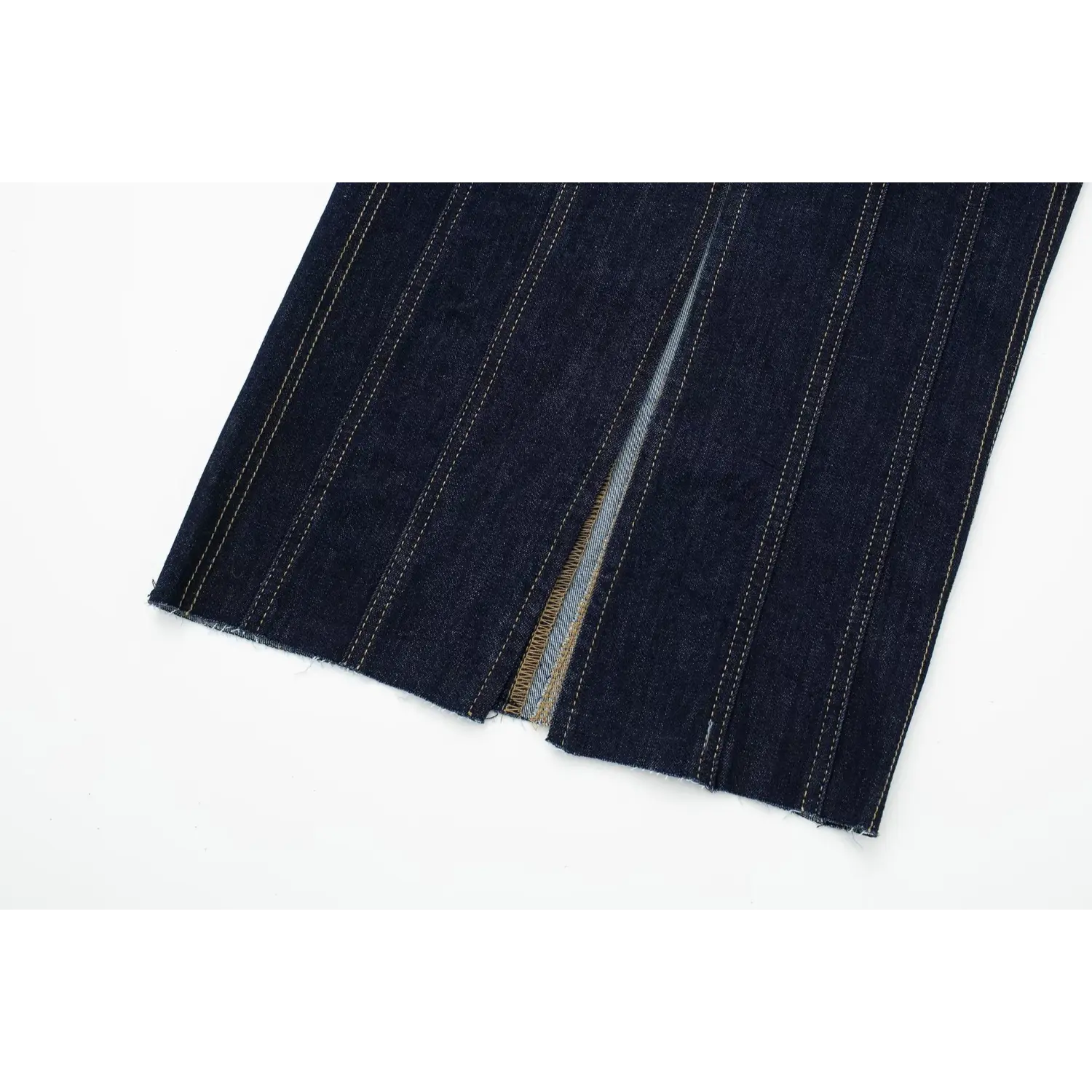 Close‑up of back hem centre slit with raw frayed edge and yellow topstitching on dark denim midi dress
