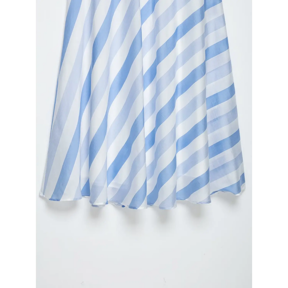 Close-up of flowing flared skirt drape