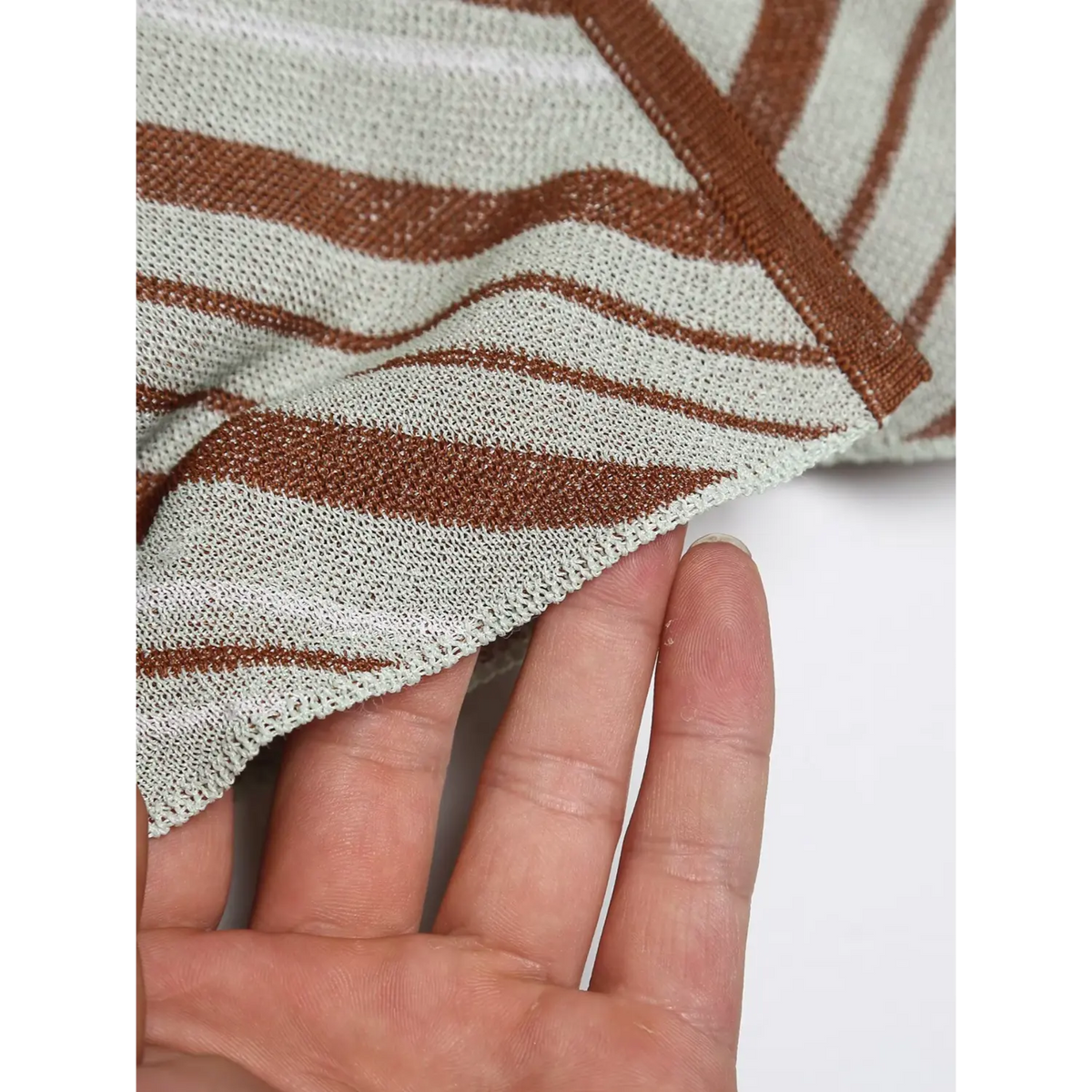 Close-up of cropped hem and raw edge