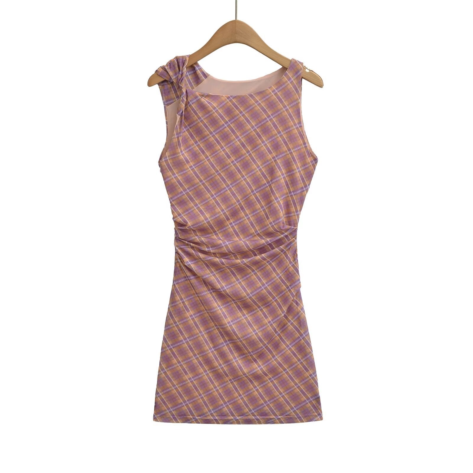 Women's purple and brown plaid mini bodycon dress with bow shoulder detail, ruched waist, sleeveless design, hanging front view.