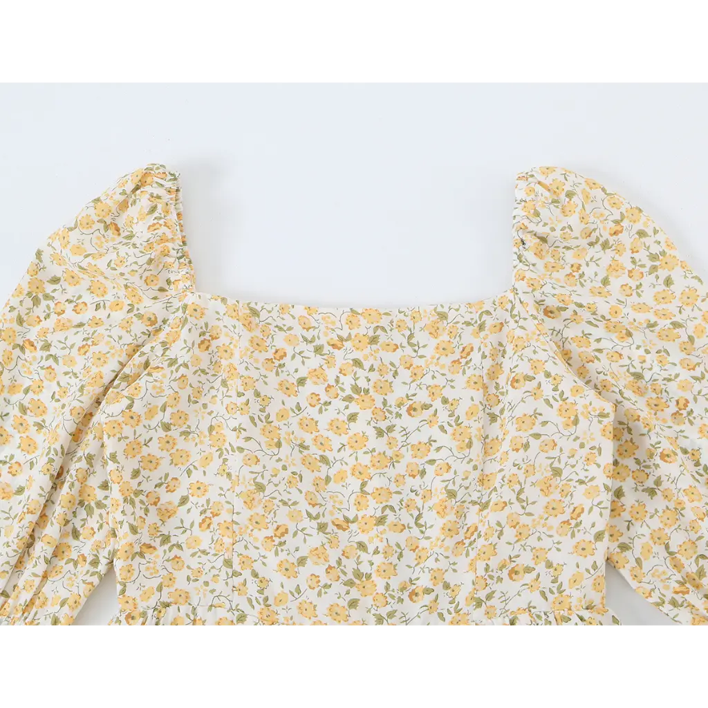Close-up of square neckline and puff shoulders