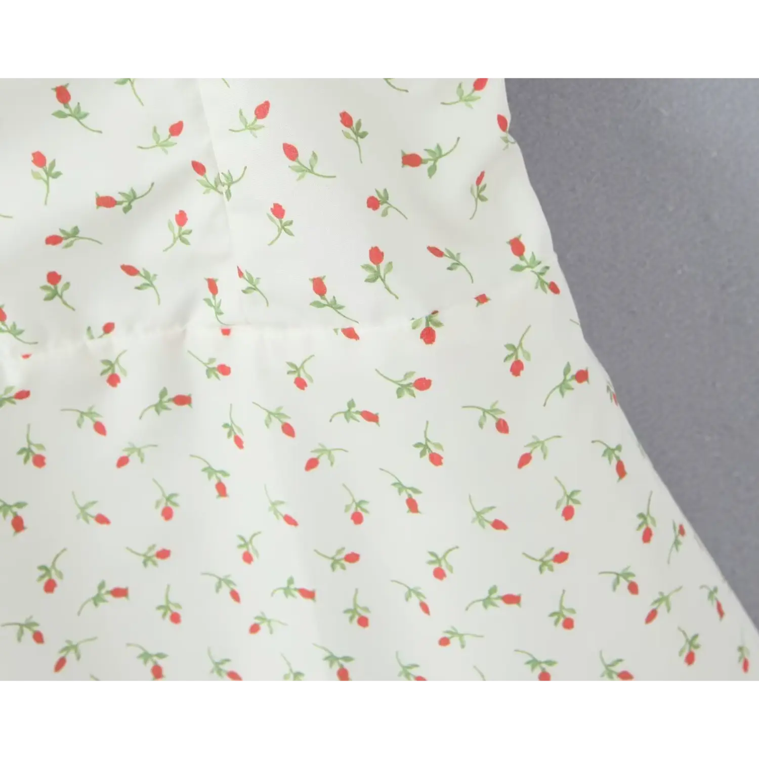 Macro close‑up waist princess seam scattered rose bud print white cami dress tailored bodice