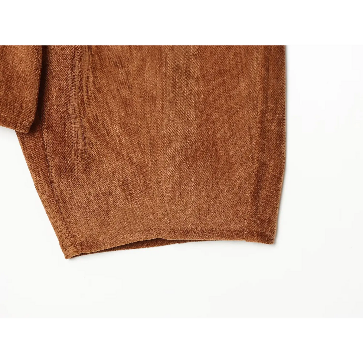 Close-up of caramel hem and side seam