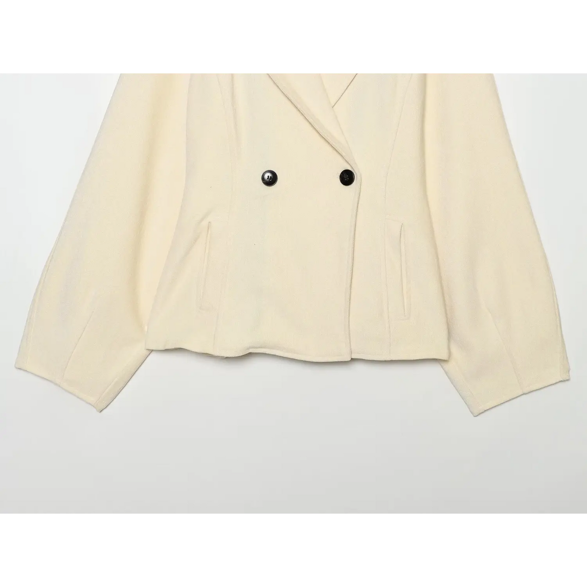 Front flat lay of cream blazer with pockets