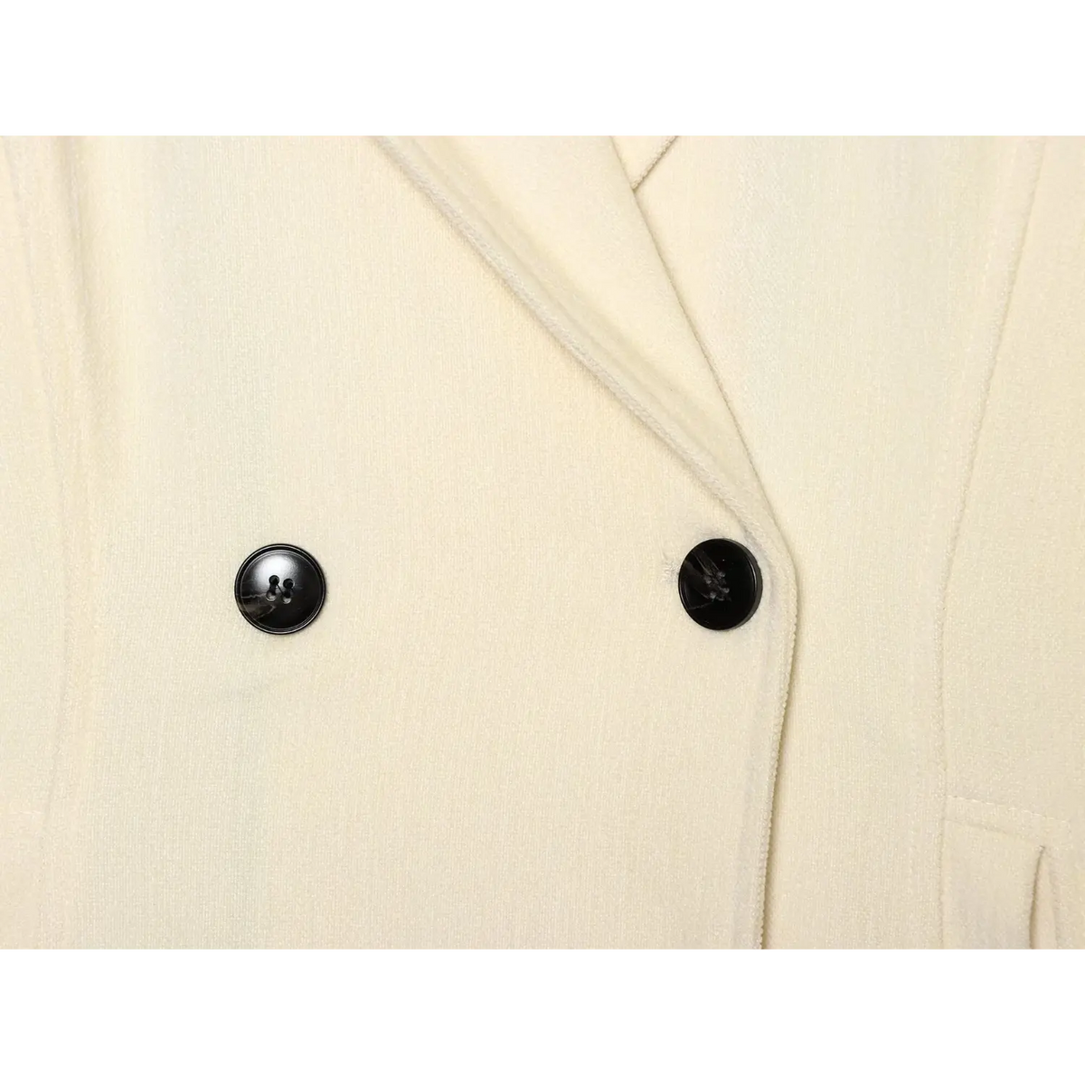 Close-up of double breasted black buttons
