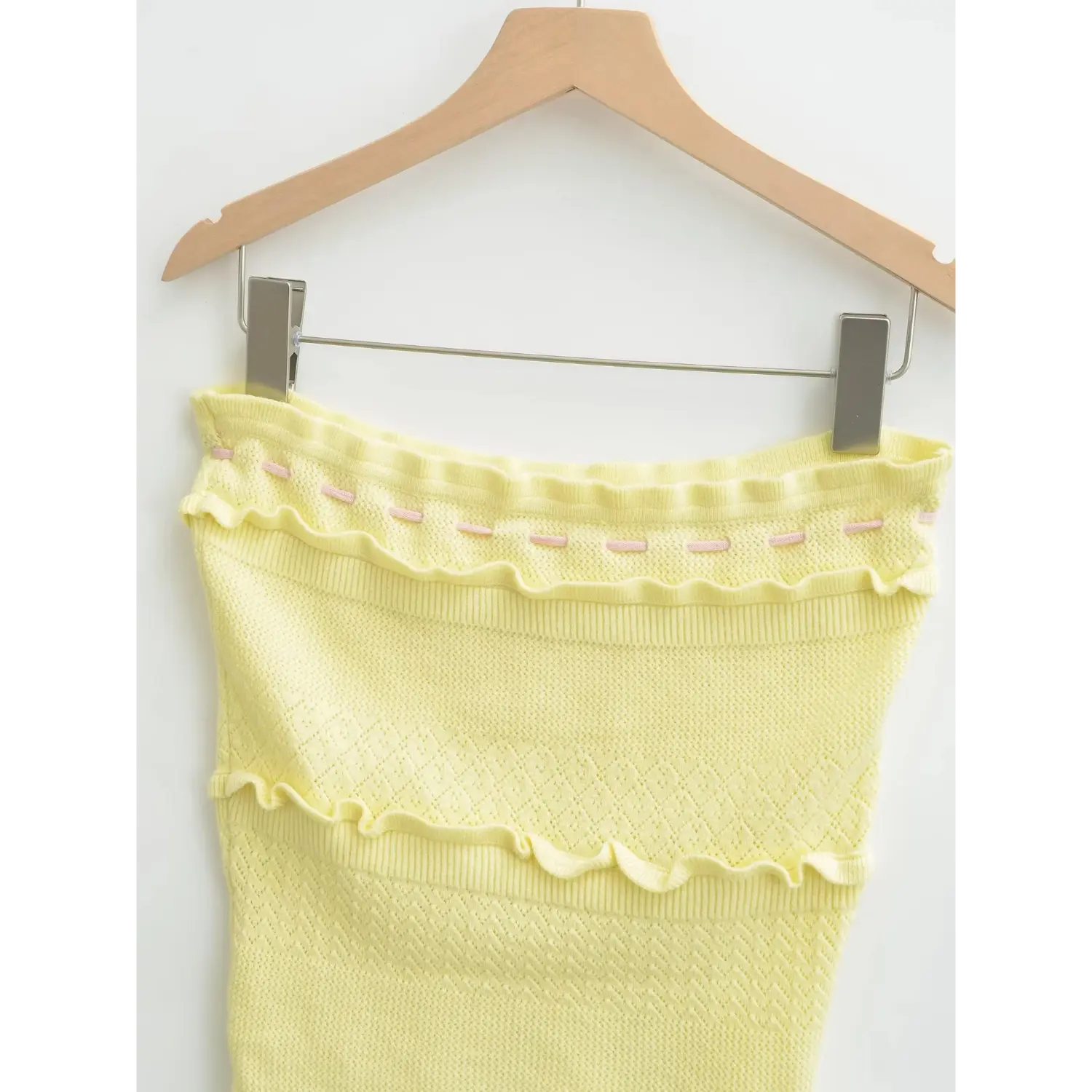 Side closeup showing two-tier ruffle construction & hollow knit panels
