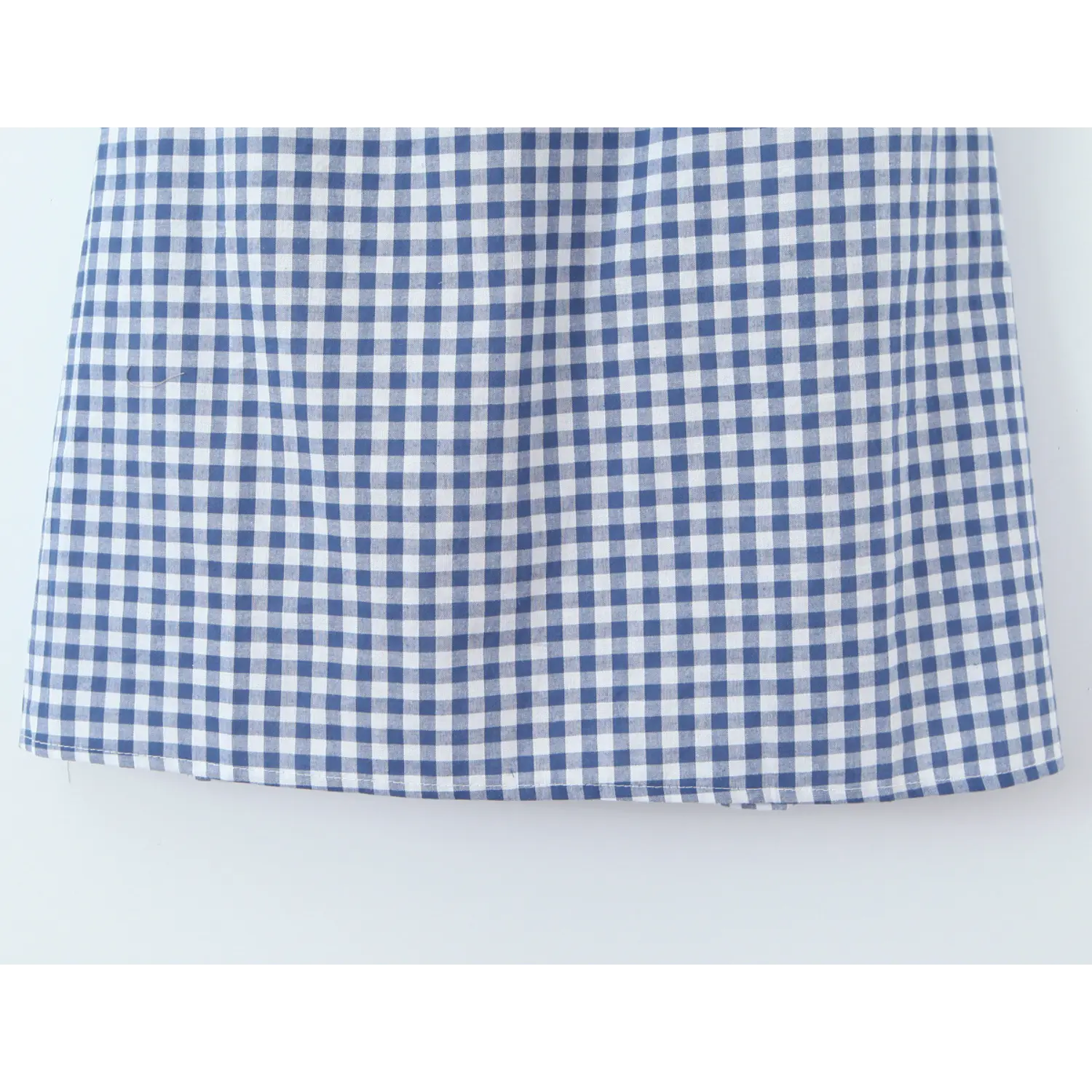 Double layer solid lining inner macro close-up, outer gingham woven + matte matching lining full non-sheer coverage neat serging double layer construction shot