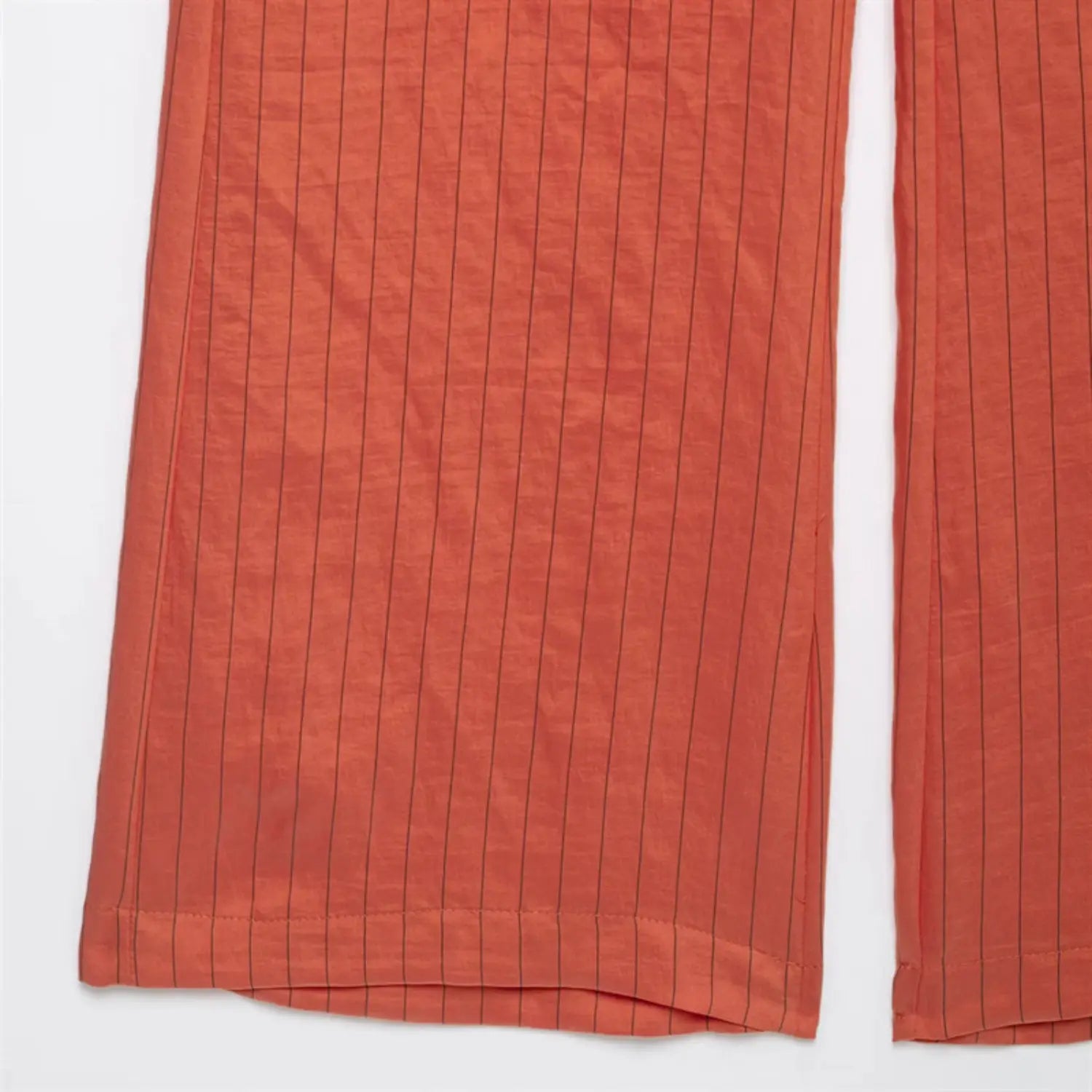 Two trouser hems side view, symmetrical straight wide leg cut, uniform hem binding, consistent vertical pinstripe layout
