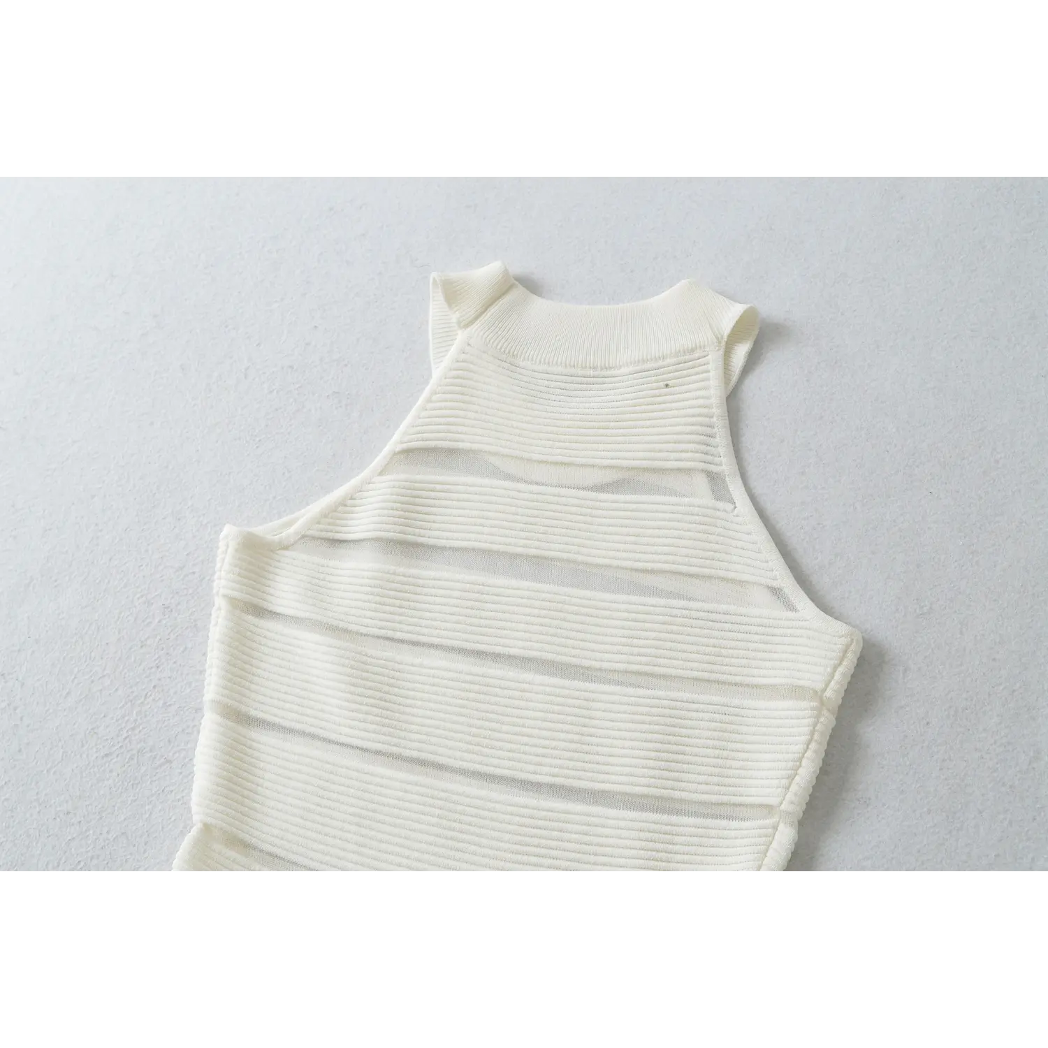 Ivory halter mini dress full back flat lay, high halter neck full segmented horizontal sheer stripes slim waist silhouette full display
