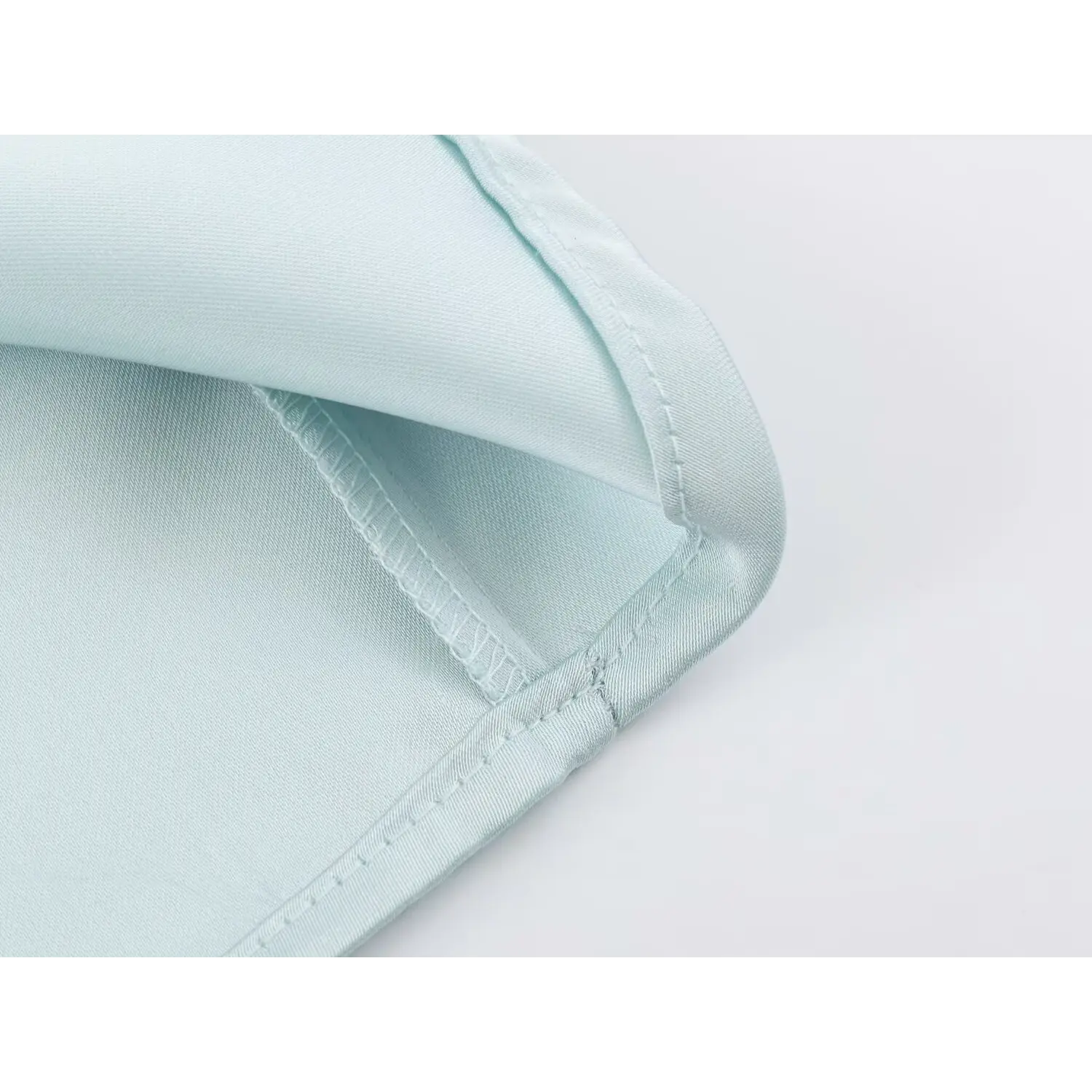 Neat folded hem stitching detail of satin mini dress