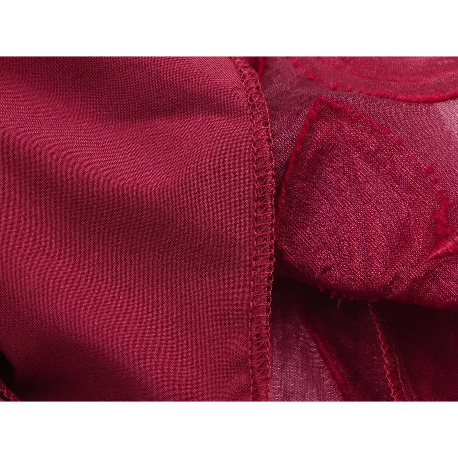 Inside flip shot solid opaque wine red full lining, neat serged overlock stitching connecting textured outer fabric
