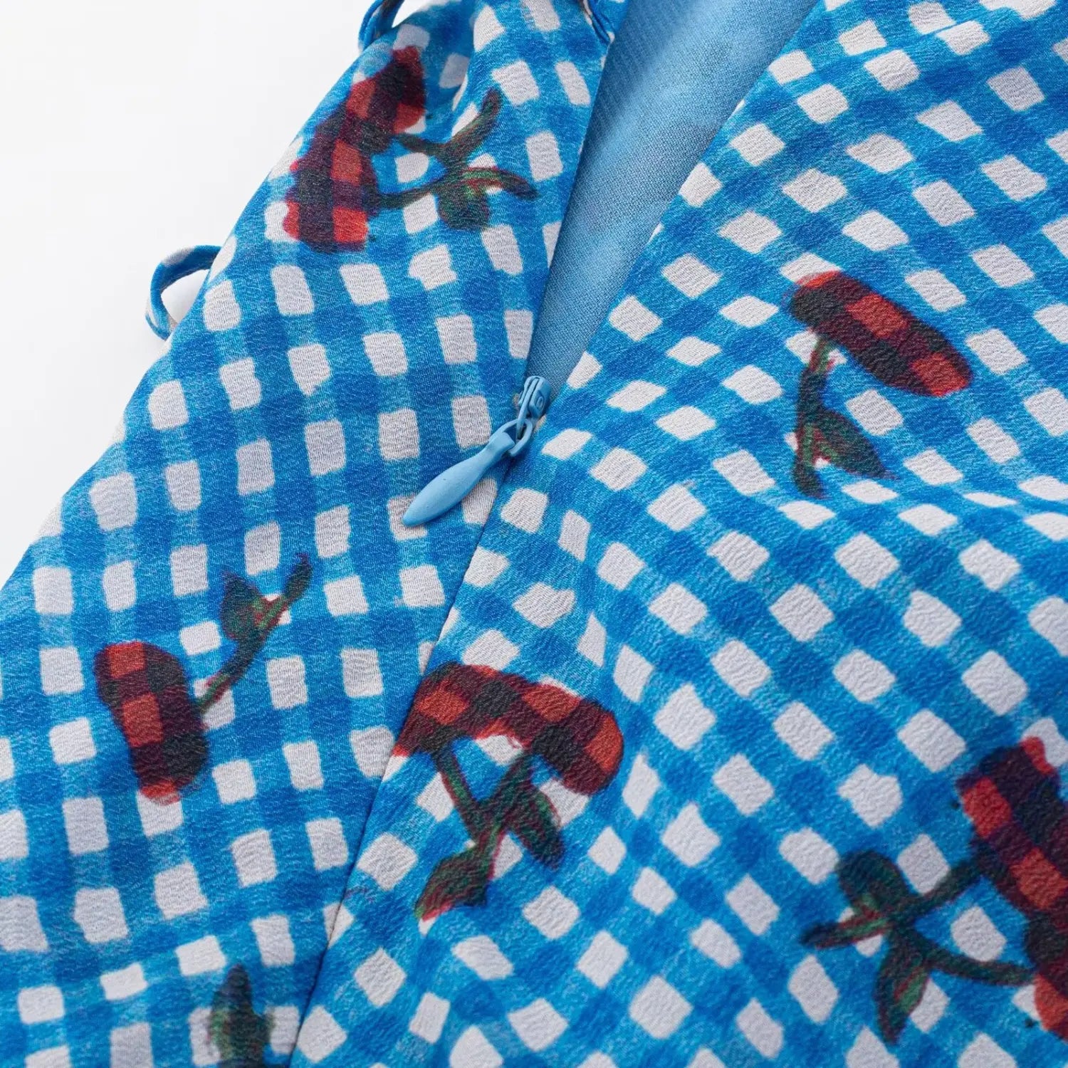 Dress side matching invisible zipper macro close-up, smooth zipper pull double binding serging easy wear inner lining craft shot