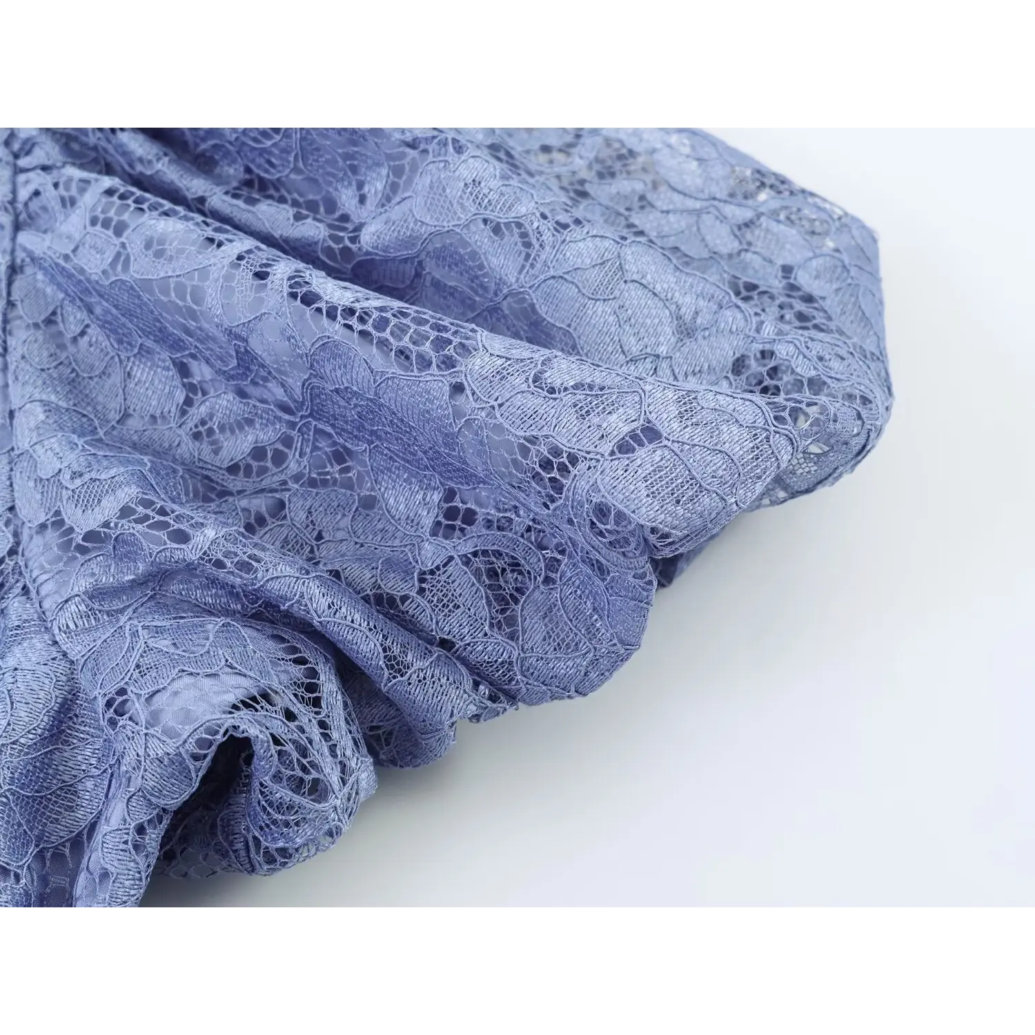 Macro shot floral lace fabric texture of dusty blue maxi dress
