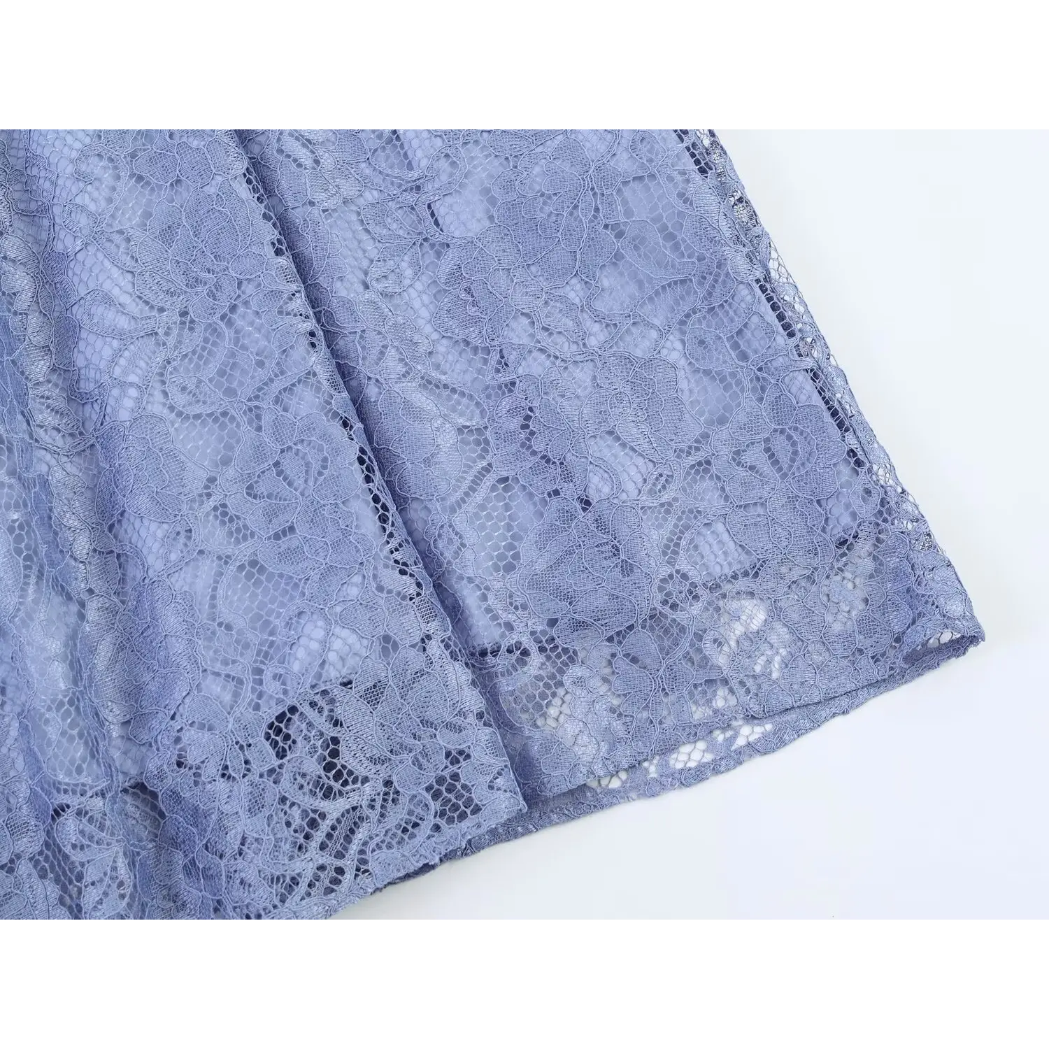 Close‑up shot of skirt hem floral lace edge dusty blue lace maxi dress