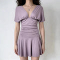 Female model wearing dusty lilac deep V flutter sleeve ruched mini dress