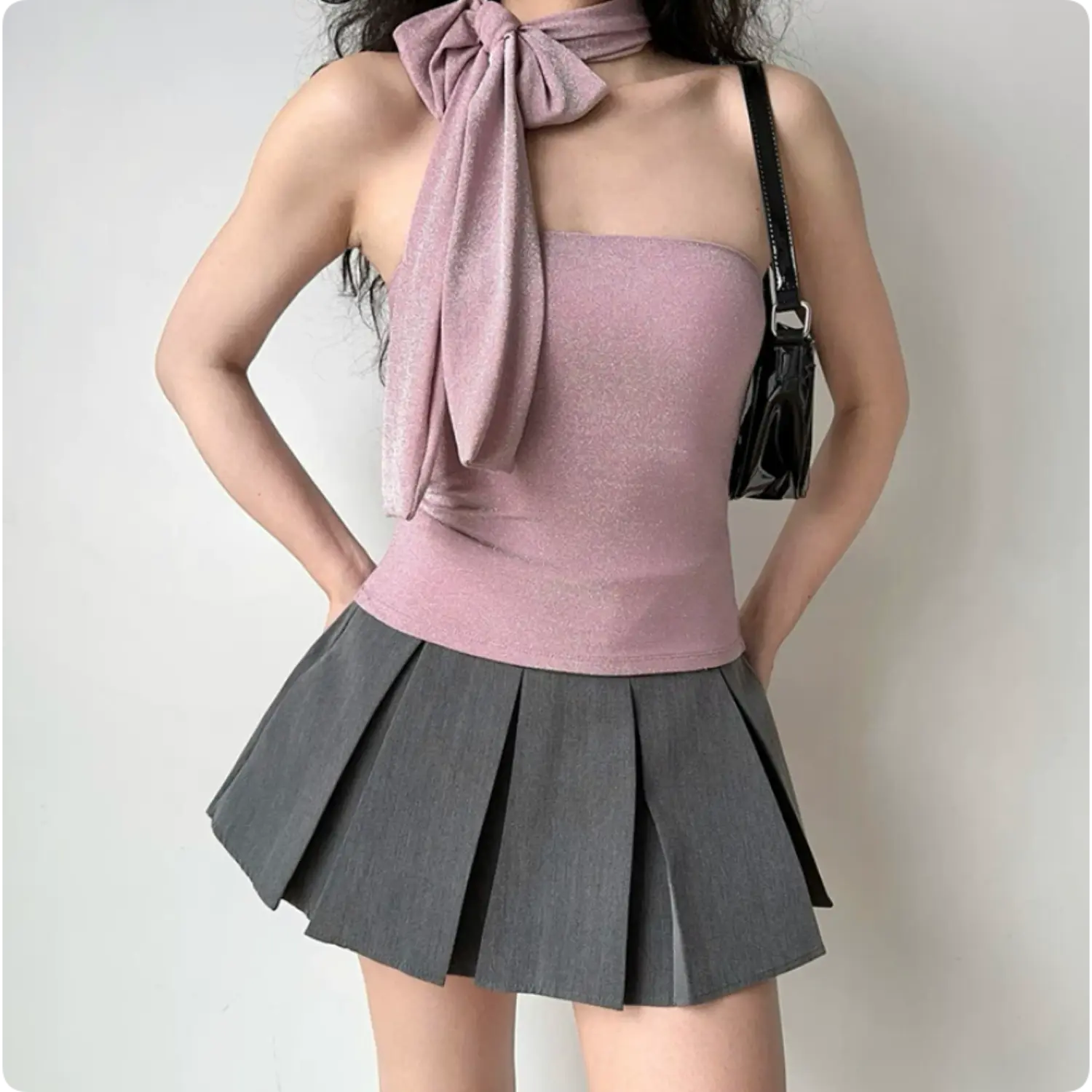 Full outfit shot dusty pink glitter tube top with bow choker, matched grey pleated mini skirt slim women streetwear cami