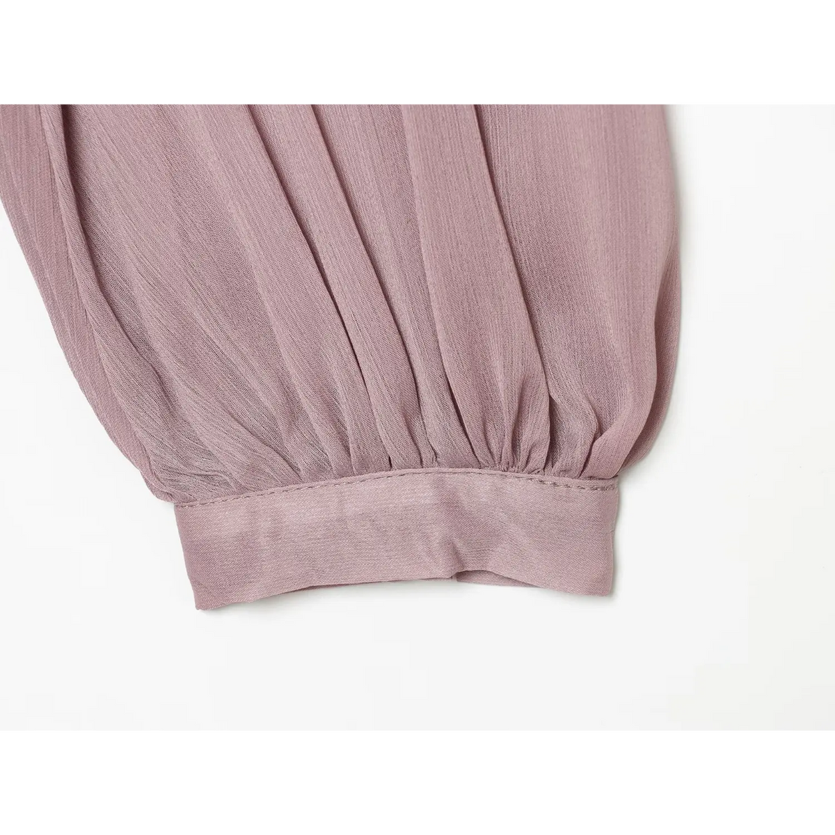 Close-up of gathered bishop sleeve and banded cuff