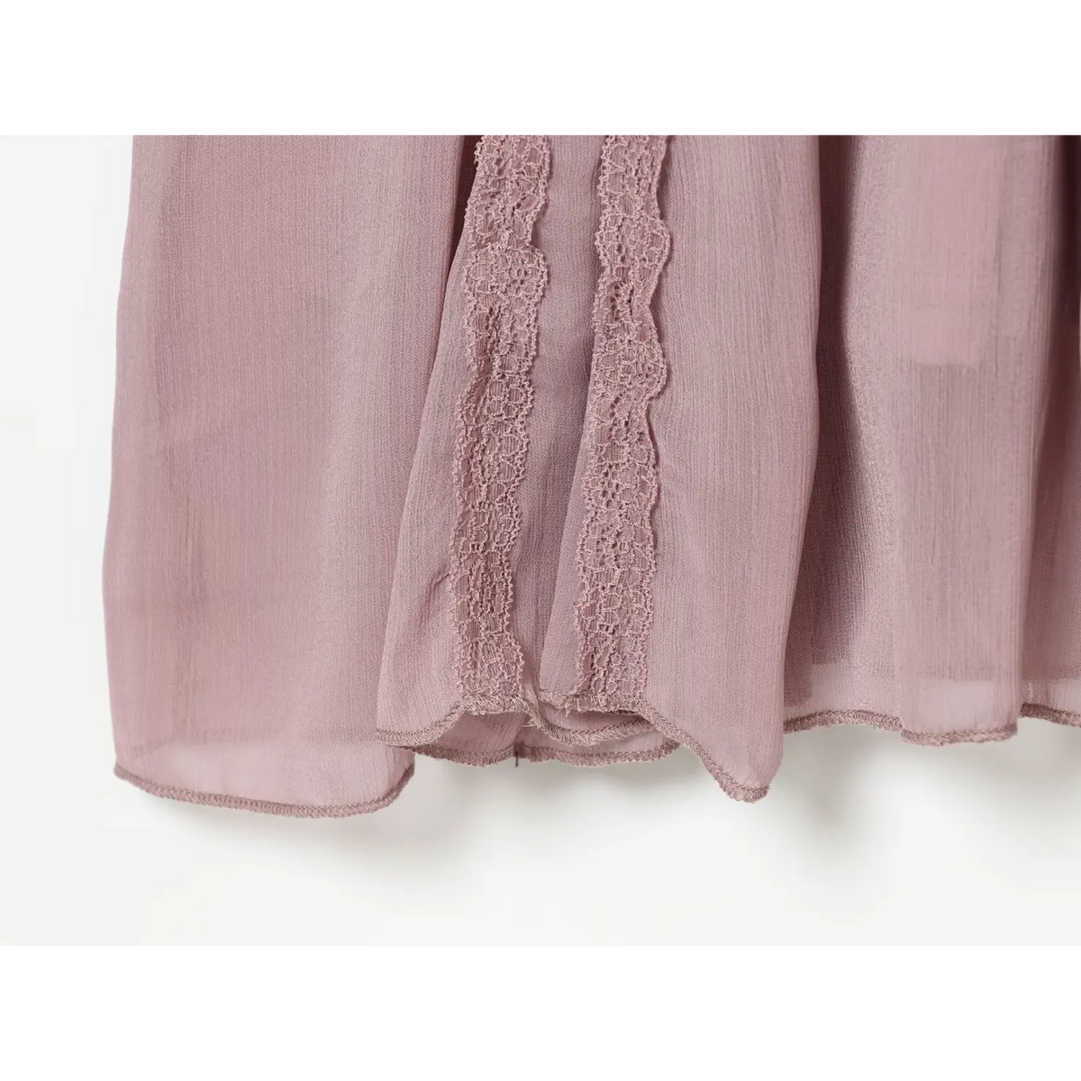 Close-up of lace trim and chiffon hem
