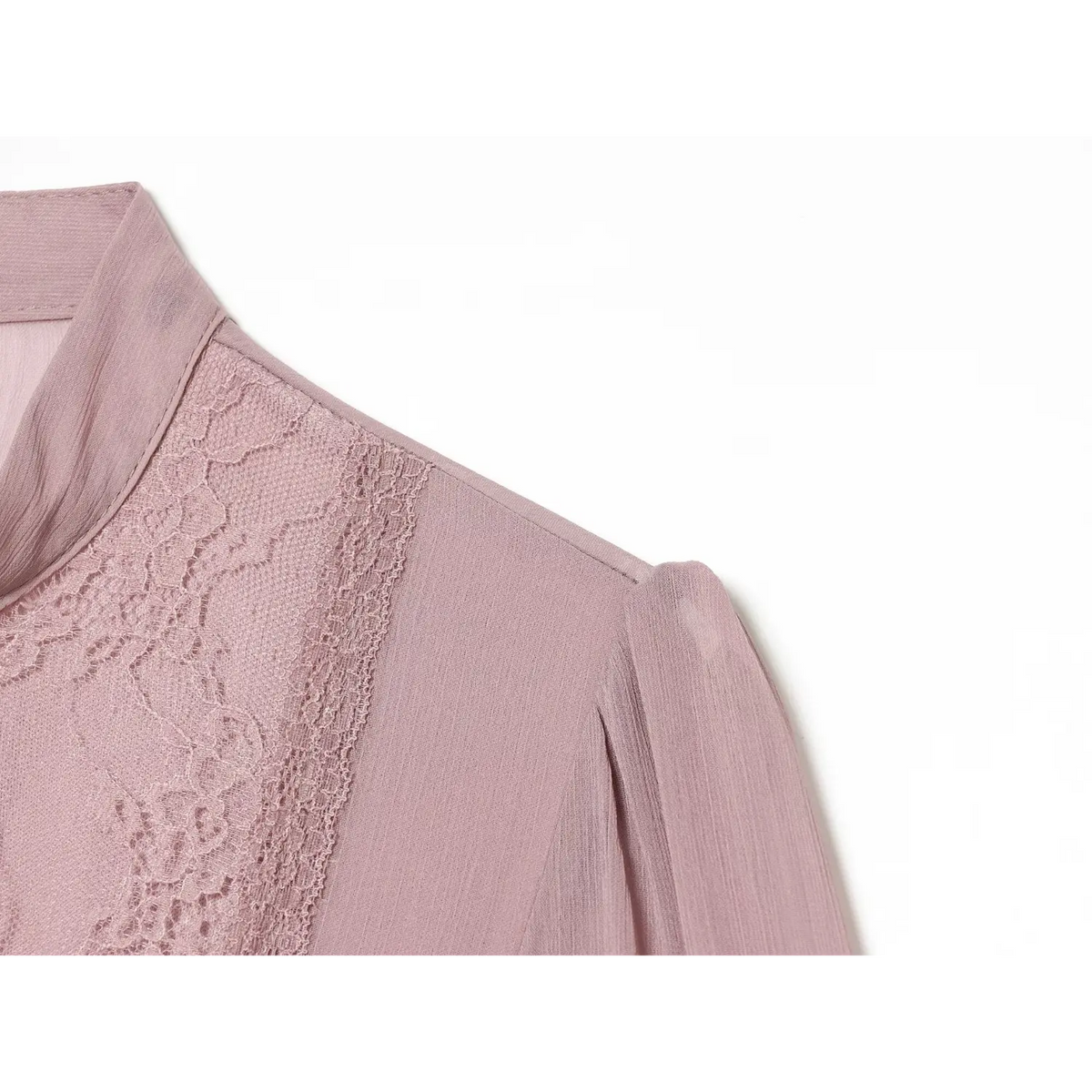 Close-up of shoulder puff and lace trim detail