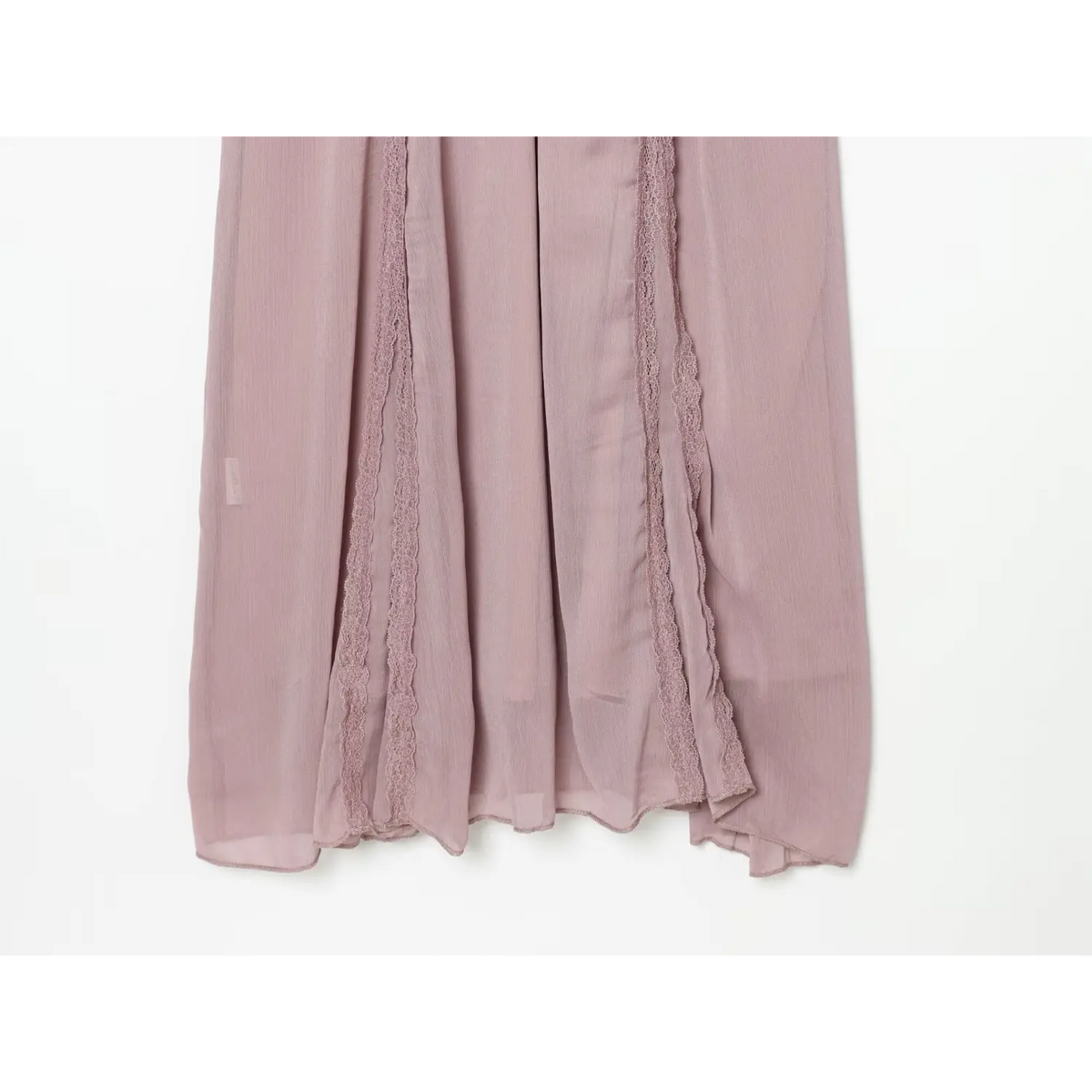 Close-up of vertical lace panels on flowing skirt