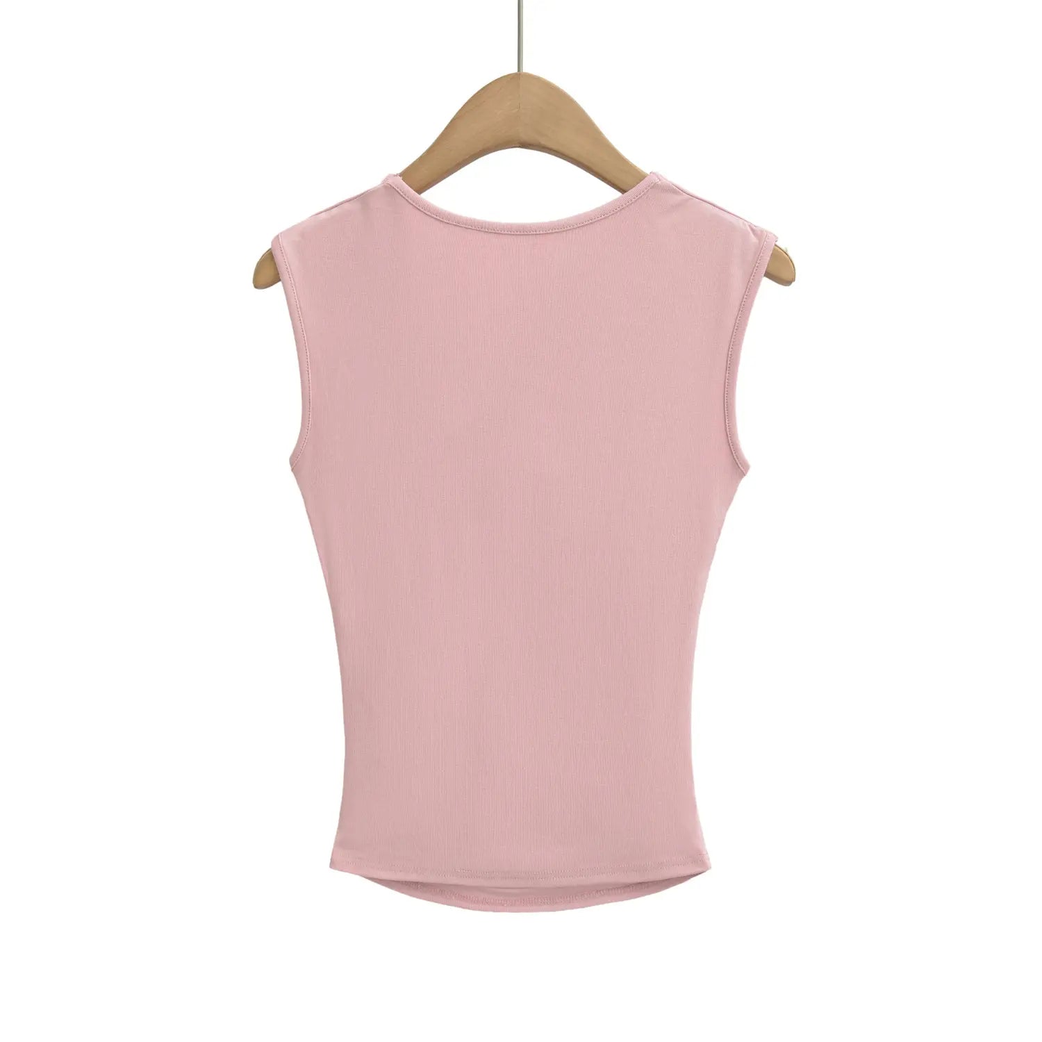 Hanging back shot of dusty pink ribbed square neck cami top on wooden hanger, plain solid back surface