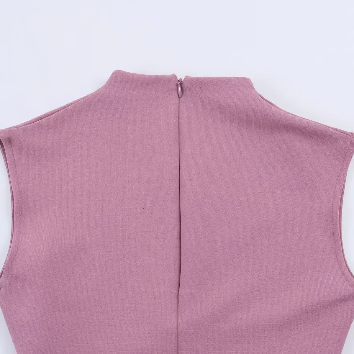 Back view of the dress's high neck and zipper, showing the vertical center seam and back closure.