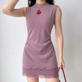 The dusty rose lace-trimmed dress styled on a model, highlighting its bodycon fit, high neckline, and elegant lace hem detail.