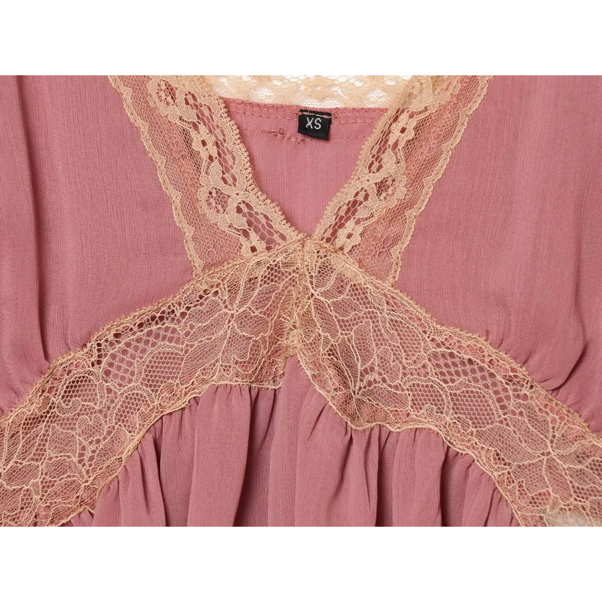 Close-up of crisscross lace inset at bust