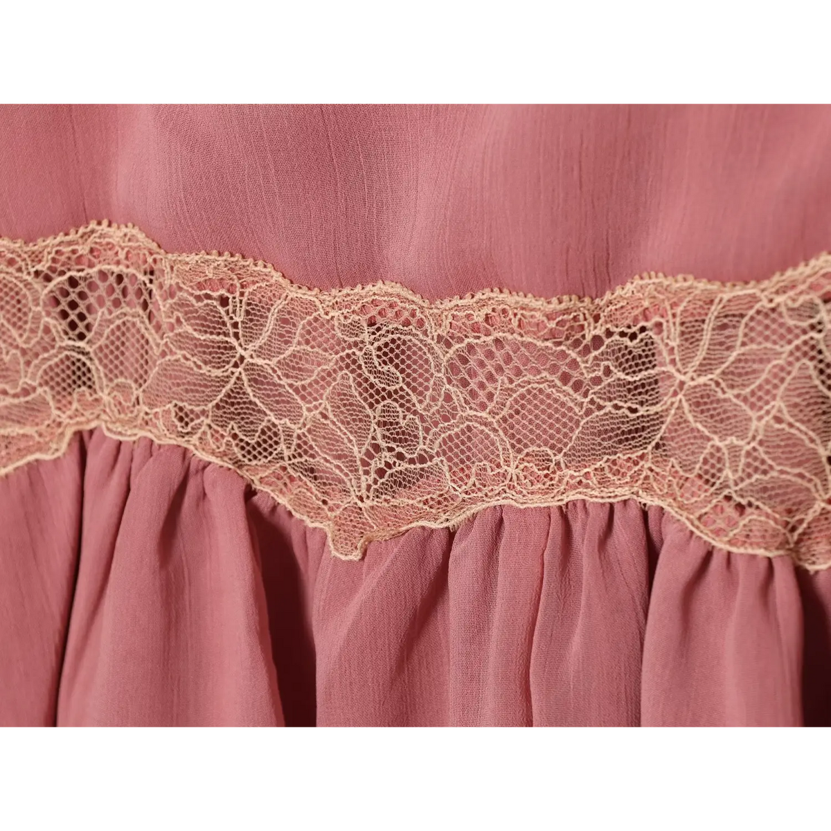 Close-up of gathered babydoll hem