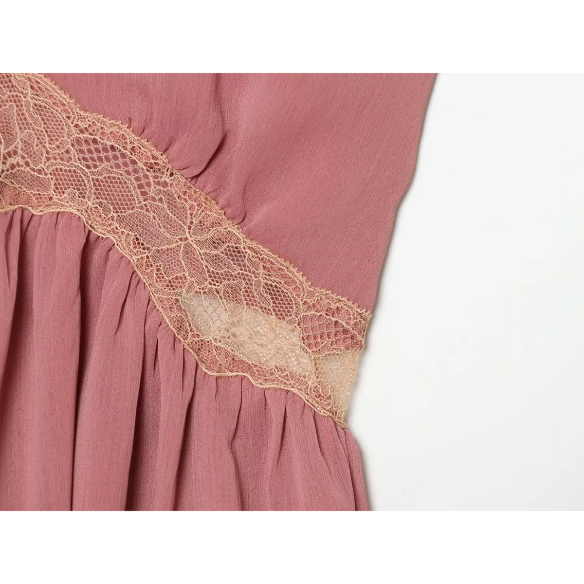 Close-up of side lace panel and gathered waist