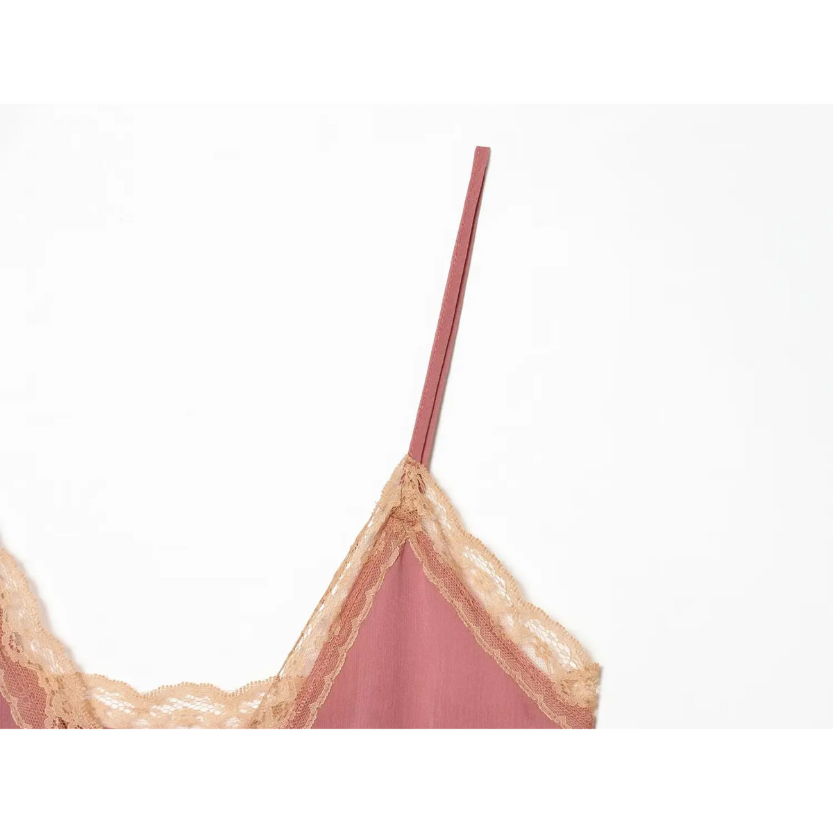 Close-up of thin spaghetti strap and lace edge