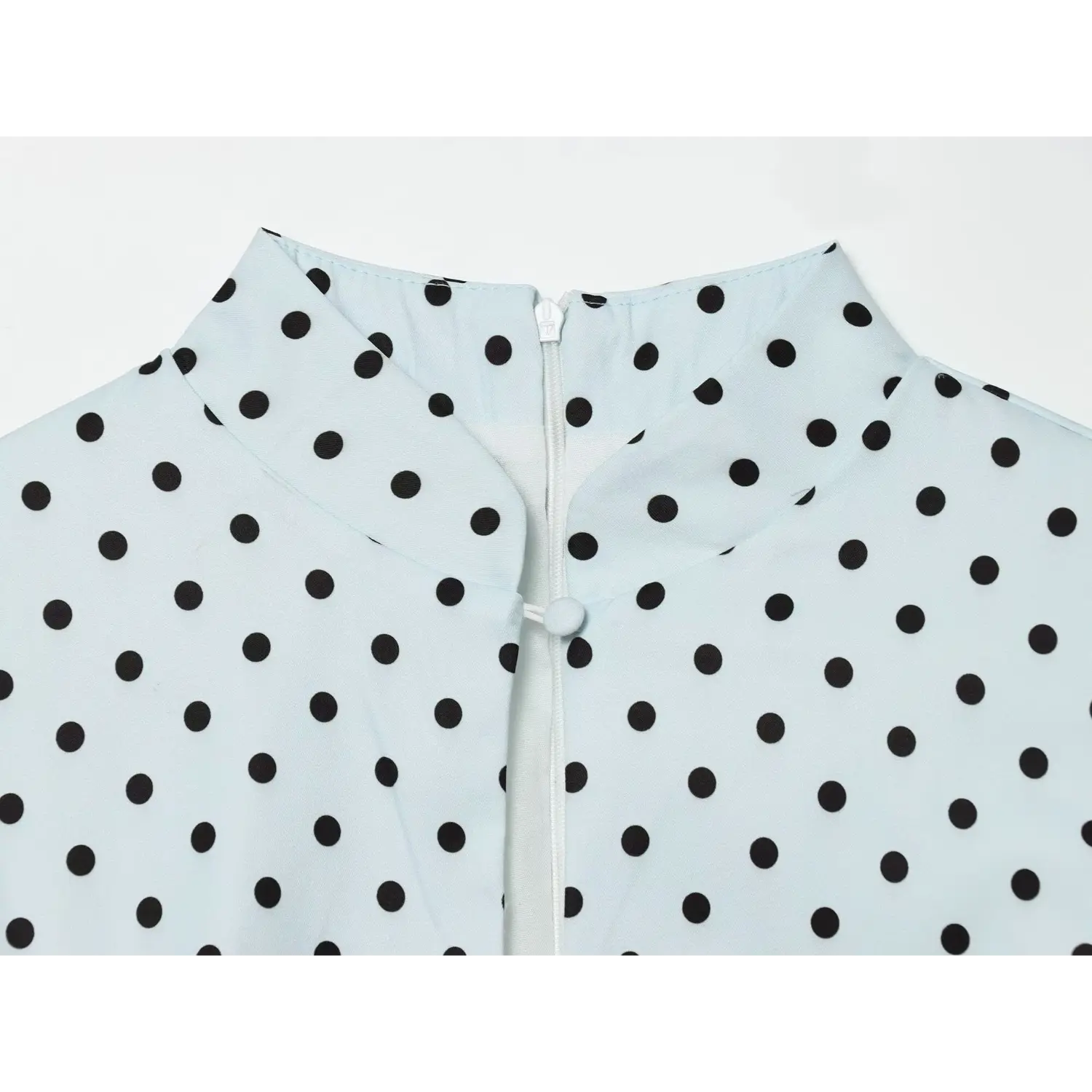 Dusty blue black polka dot dress collar close‑up,stand collar,back concealed zipper,fabric knot button