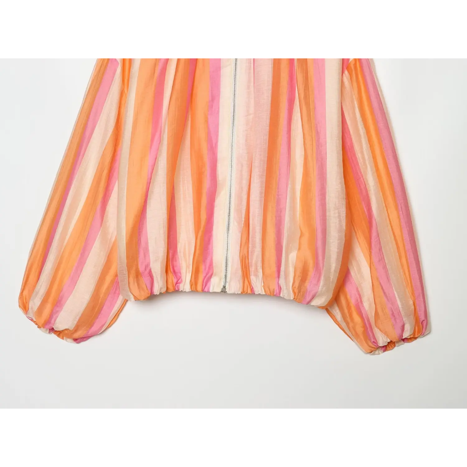 Lower front partial shot, elasticated hem, front zip closure, relaxed cropped bomber silhouette