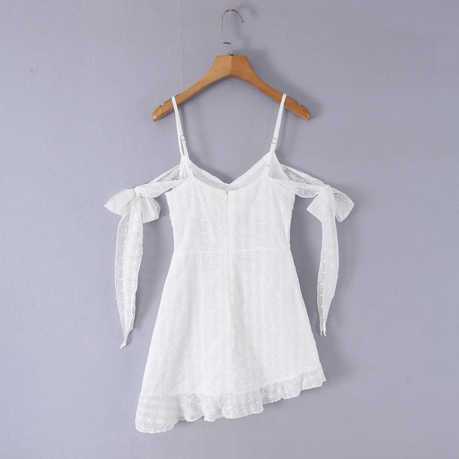 Eyelet mini slip dress wooden hanger back overview shot, clear display adjustable slider straps center invisible zipper waist fitted back panel shot