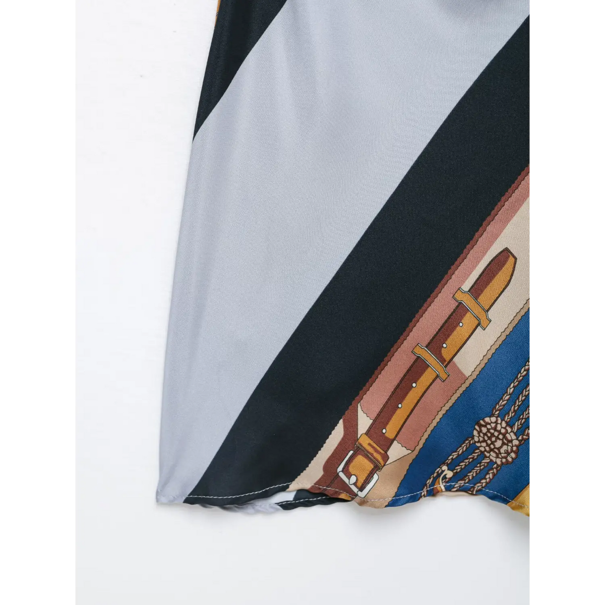 Close-up of dress hem and belt print