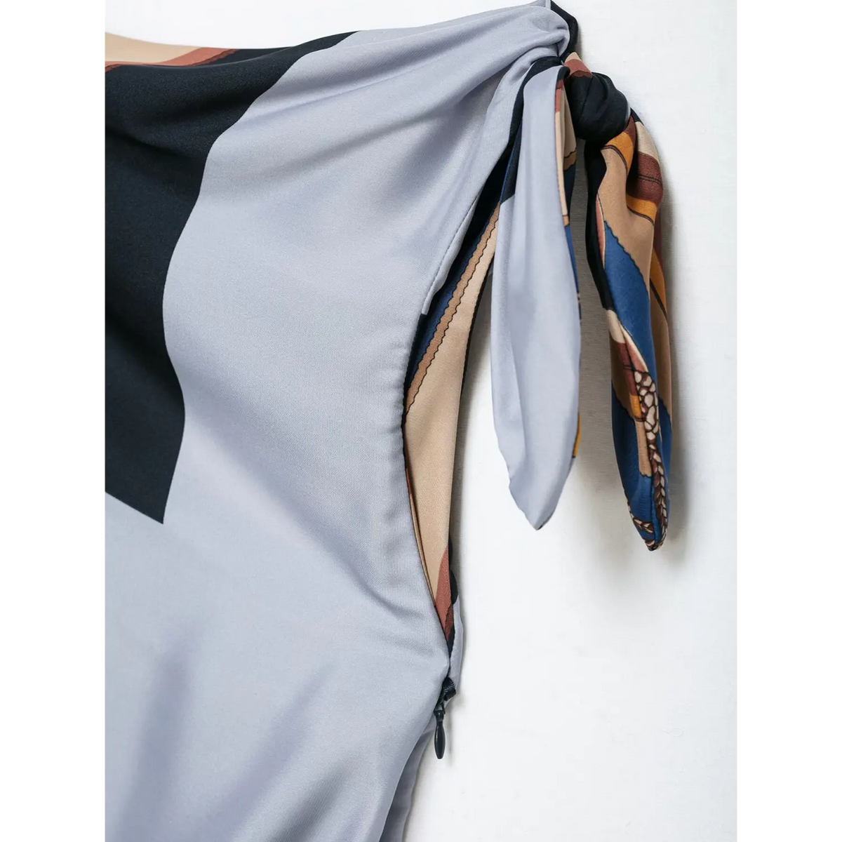 Close-up of shoulder tie knot and side zipper
