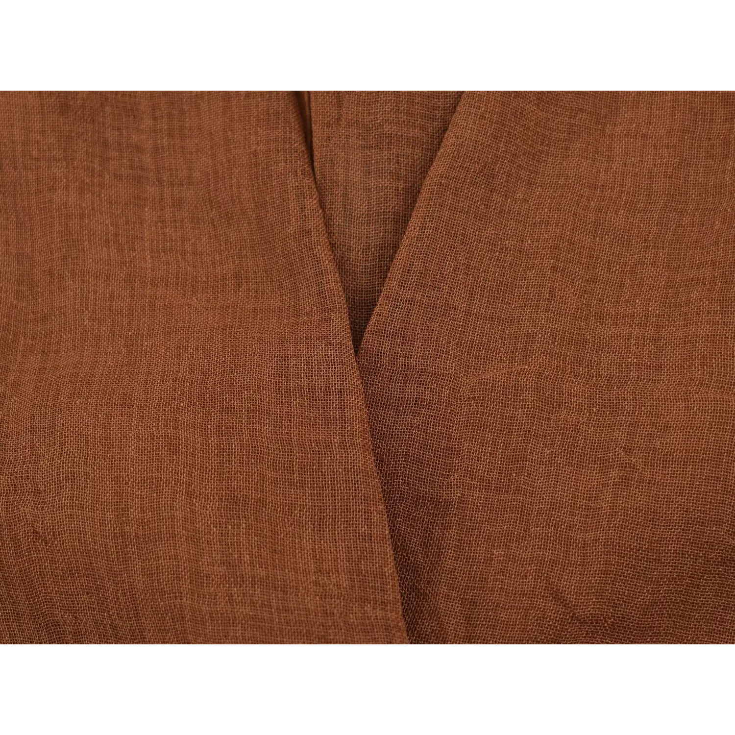 Body fabric close-up, natural crinkle textured woven material, matte solid coffee tone