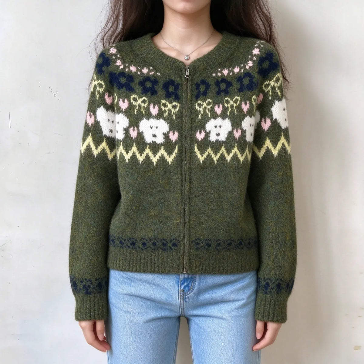 Model wearing olive green fair Isle animal knit zip cardigan, front view